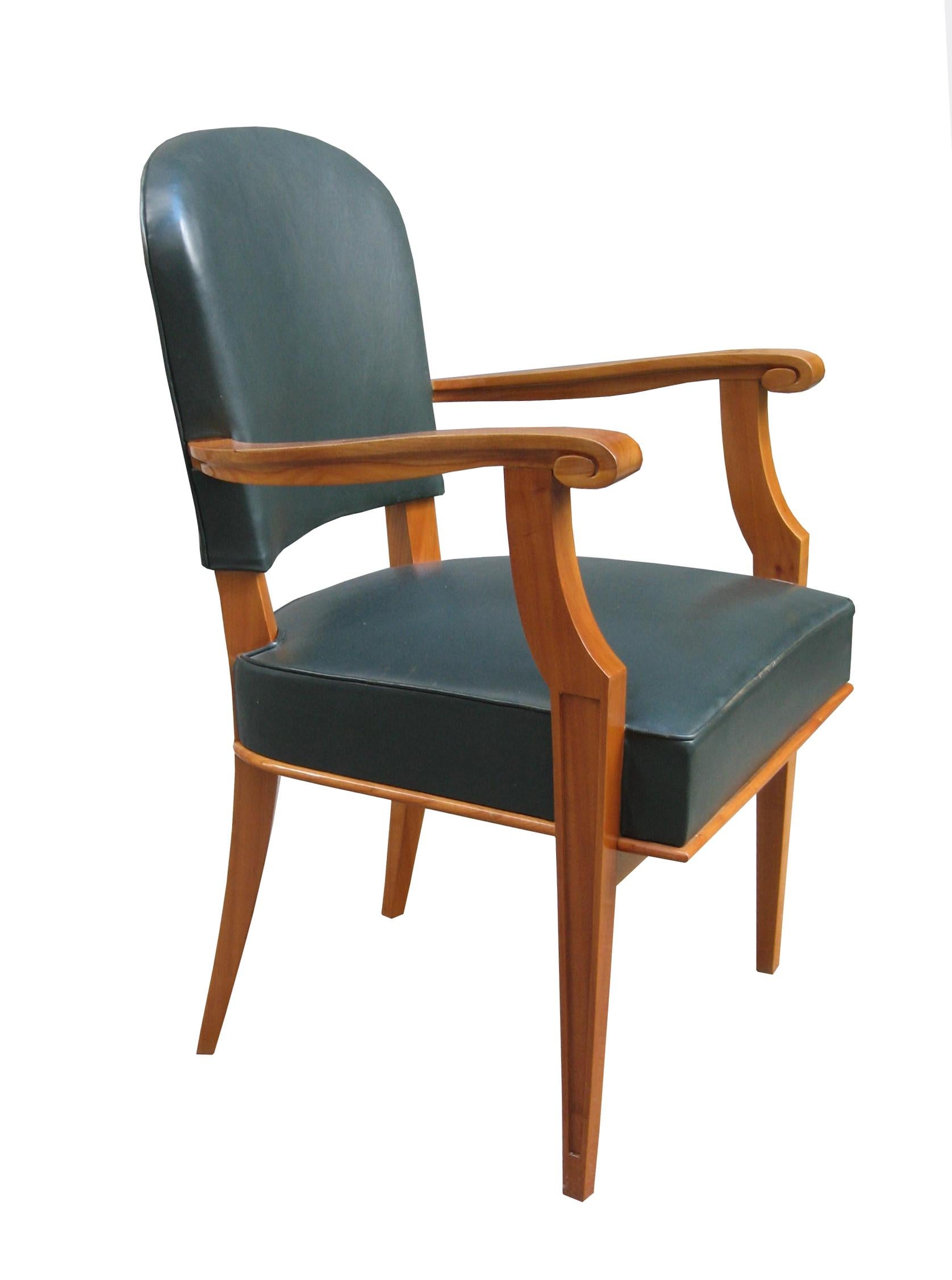 Pair of armchairs attributed to Jean Pascaud.
Solid fruitwood with the original leather.    
   