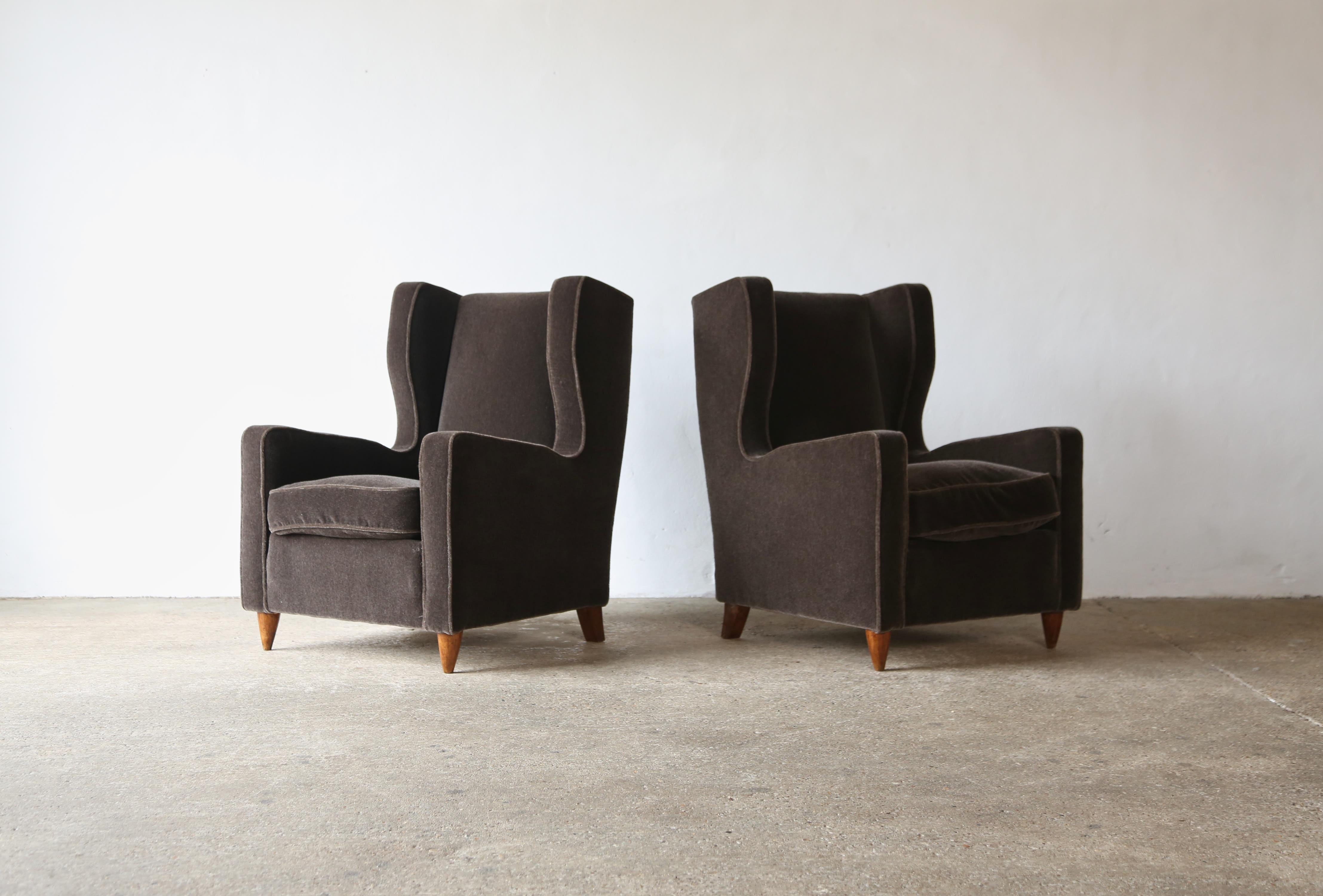 A handsome pair of armchairs attributed to Paolo Buffa, Italy, 1950s.   The chairs are newly upholstered in a premium taupe (dark brown with a hint of grey) pure mohair fabric and feather seat cushions.    Fast shipping worldwide.
  
