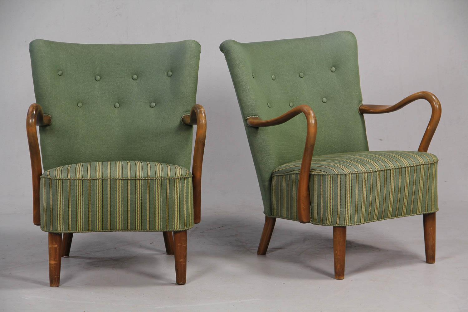 Pair of open armchairs by Danish designer Alfred Christensen, in beech, upholstered in light green wool, curved wooden arms and solid beech legs, 1940s-1950s. Produced by Slagelse Møbelværk.