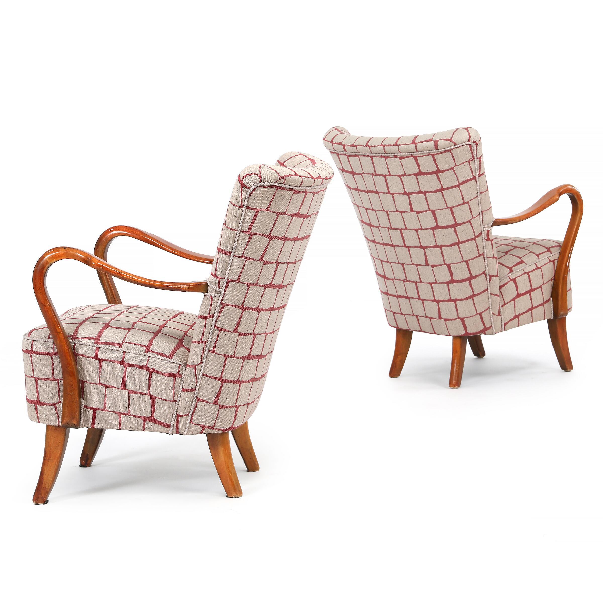 Pair of open armchairs by well-known Danish designer Alfred Christensen, in original red and off-white patterned fabric from 1950's still in good condition. The curved open arms and form create the greatest comfort, elegant klismos-style legs