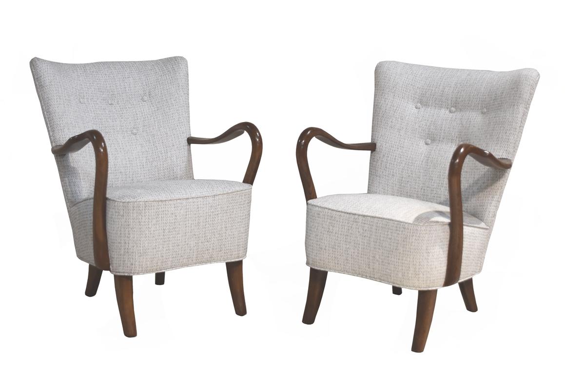 Pair of Danish modern low-backed armchairs by Danish designer, Alfred Christiansen. Newly 
recovered in oatmeal fabric. Handsome form with open curved arms and sabre legs, from 
1950's.
