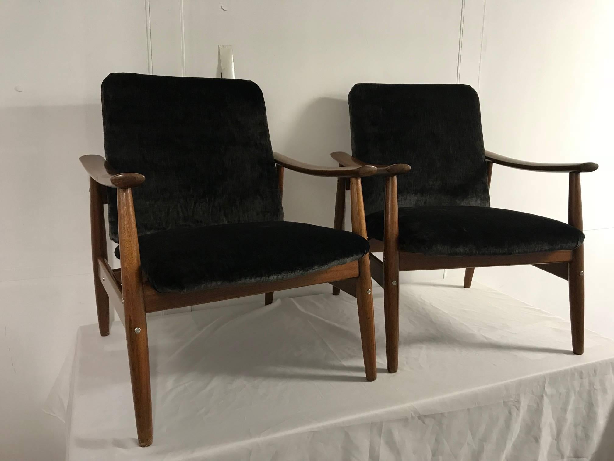 Pair of tropical wood armchairs by Altamira, Portugal, 1960s, recently reupholstered with a black velvet.