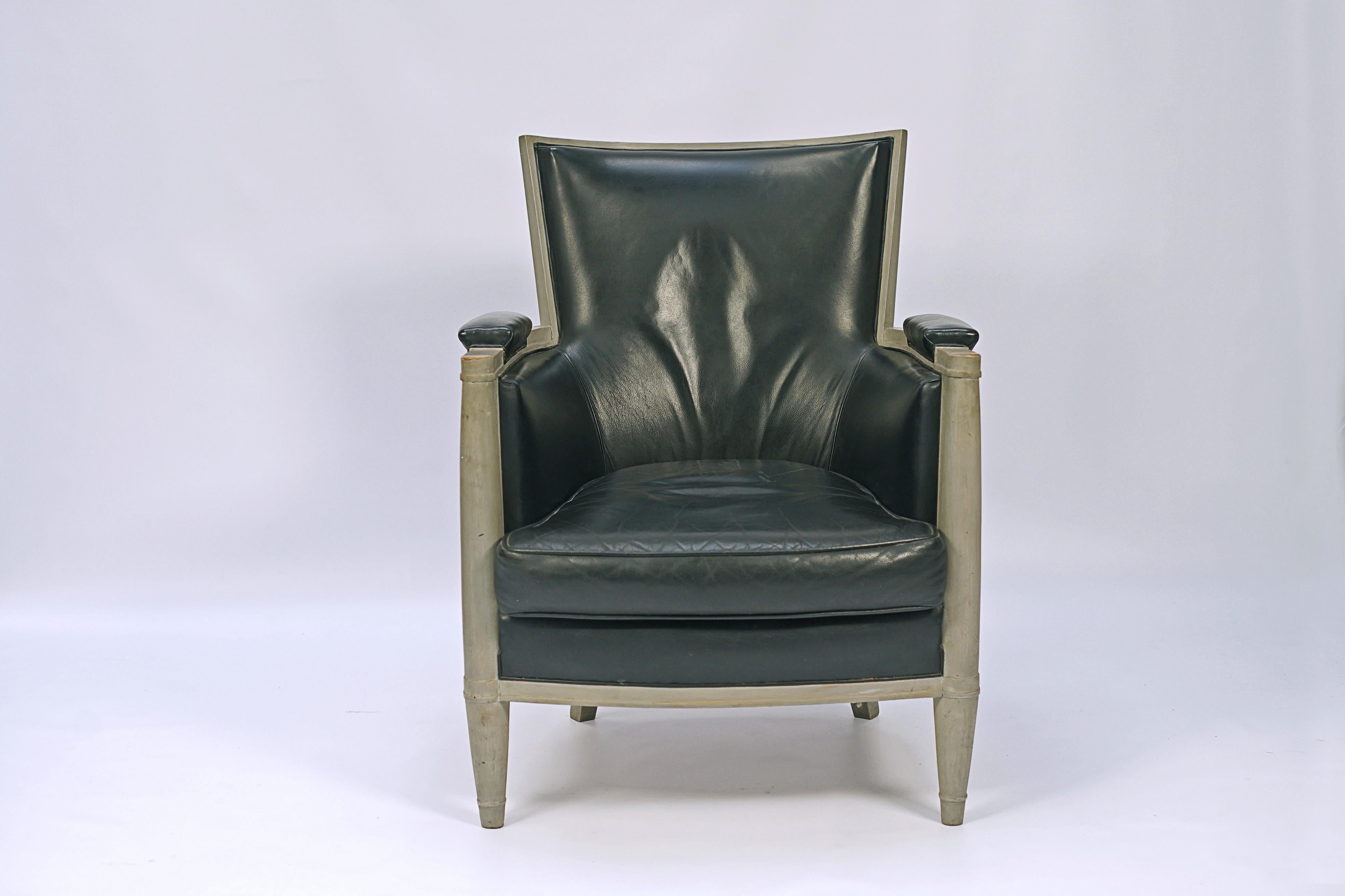 Pair of armchairs designed by Andre Arbus (1903-1996). Oak wood with silver colored patina and leather upholstery.

France, circa 1940.