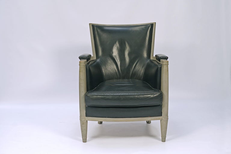 Pair of armchairs designed by Andre Arbus (1903-1996). Oak wood with silver colored patina and leather upholstery.

France, circa 1940.