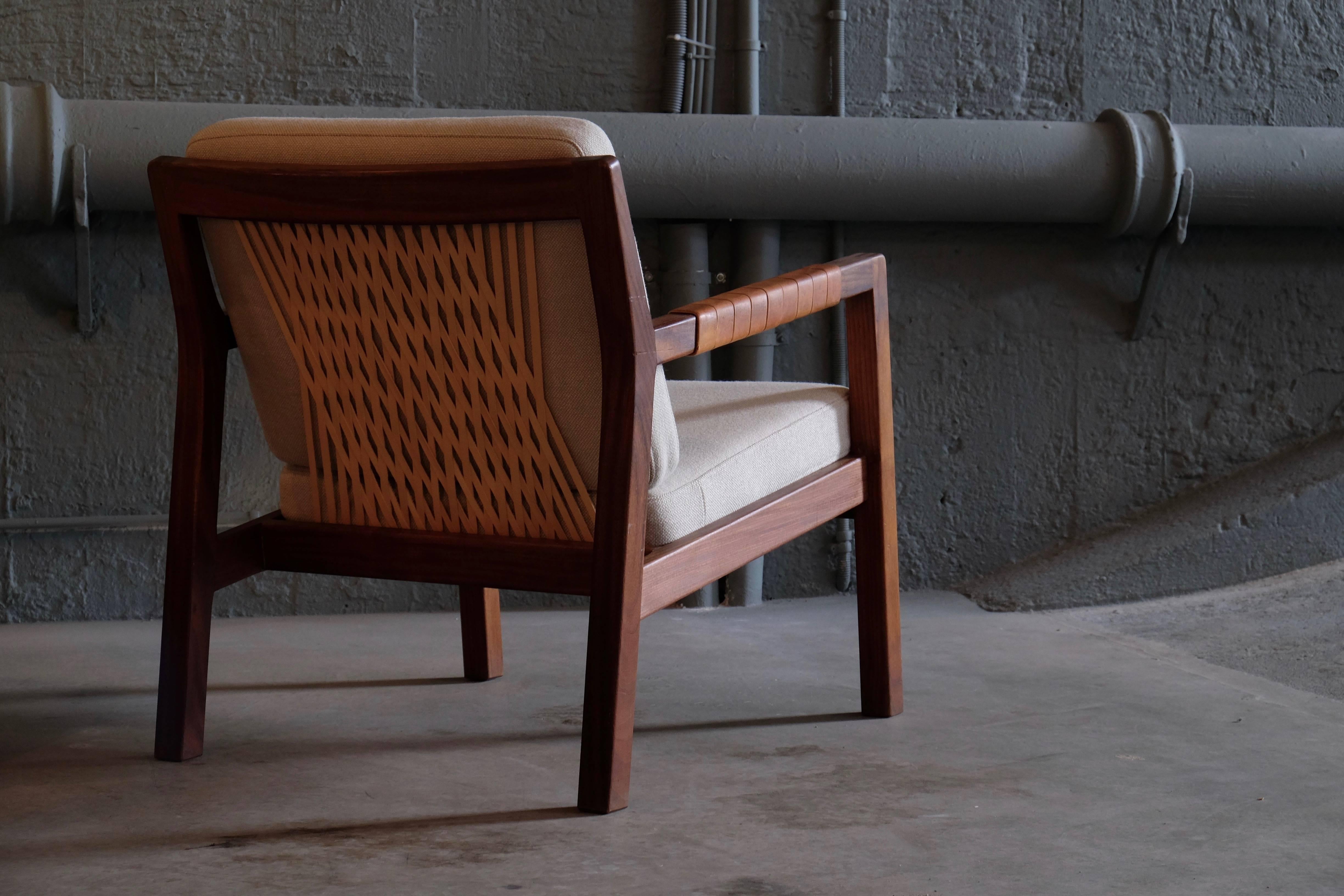 Rare armchairs model Trienna by Carl-Gustav Hiort af Orna¨s, Finland, 1950s.
Teak, leather covered armrests, back with braided leather straps, loose cushions reupholstered in Kvadrat fabric.
   
   
