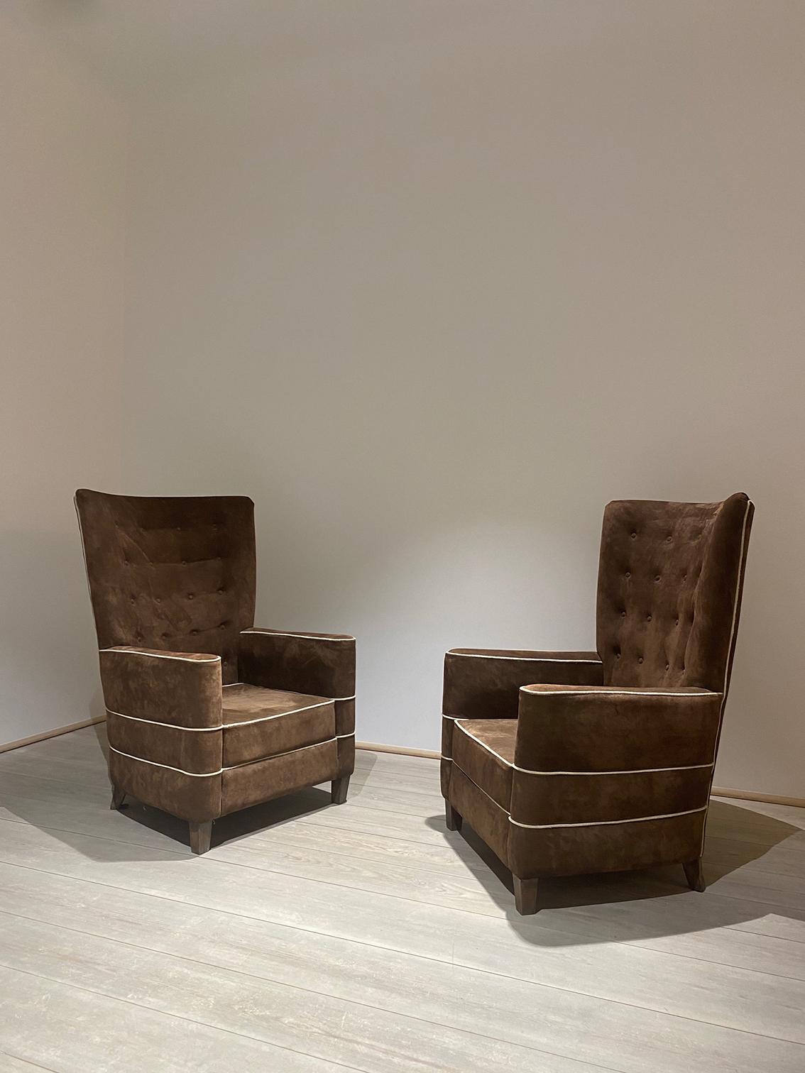 Rare armchairs with high back seat made of walnut and a suede cover in brown. These two pieces are made with refinely crafted details. Pure and elegant feel. One armchair available.

Guglielmo Ulrich (1904 – 1977) was an Italian architect, furniture