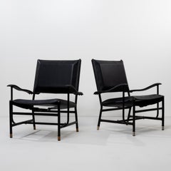 Pareja de sillones de Jacques Adnet