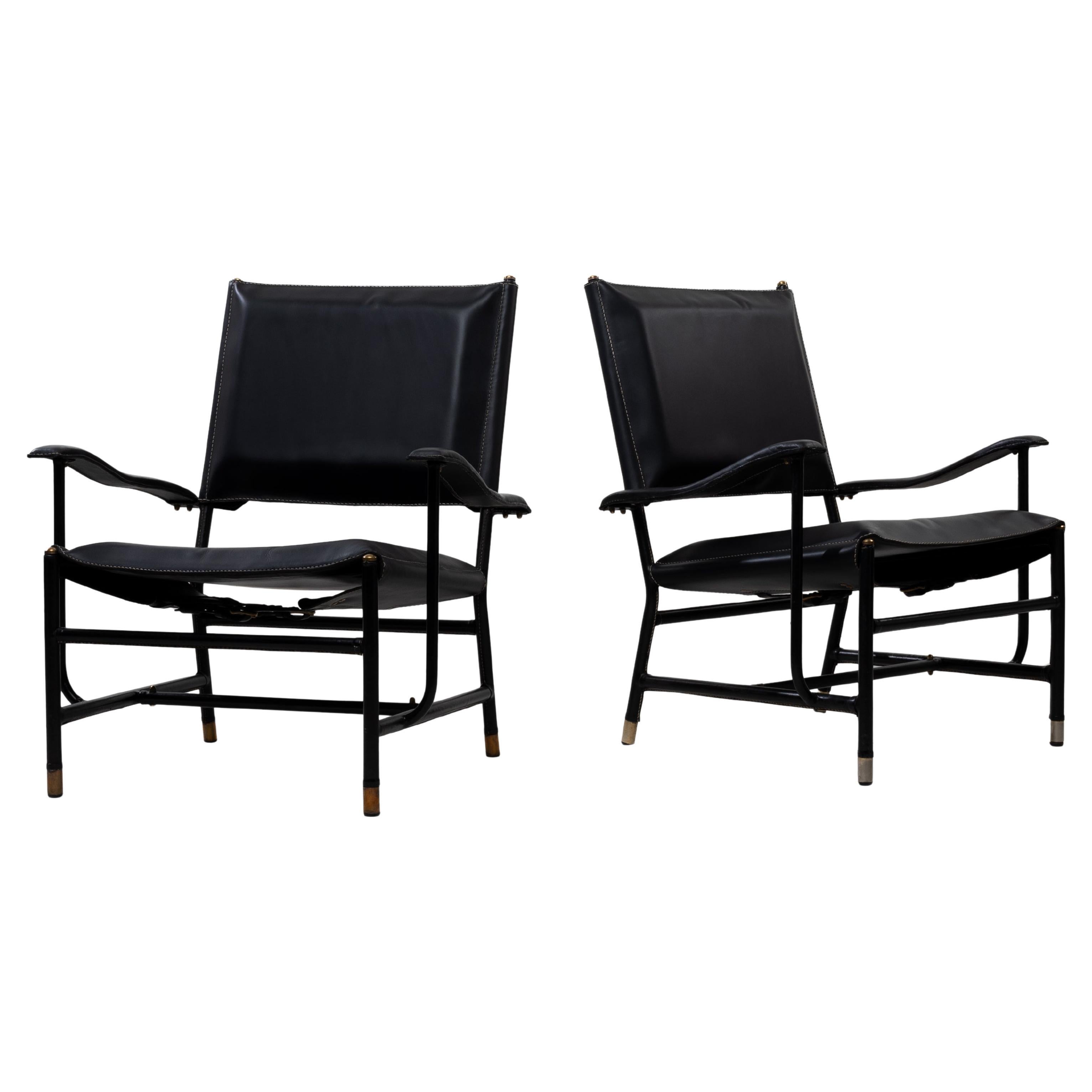 Pair of armchairs by Jacques Adnet