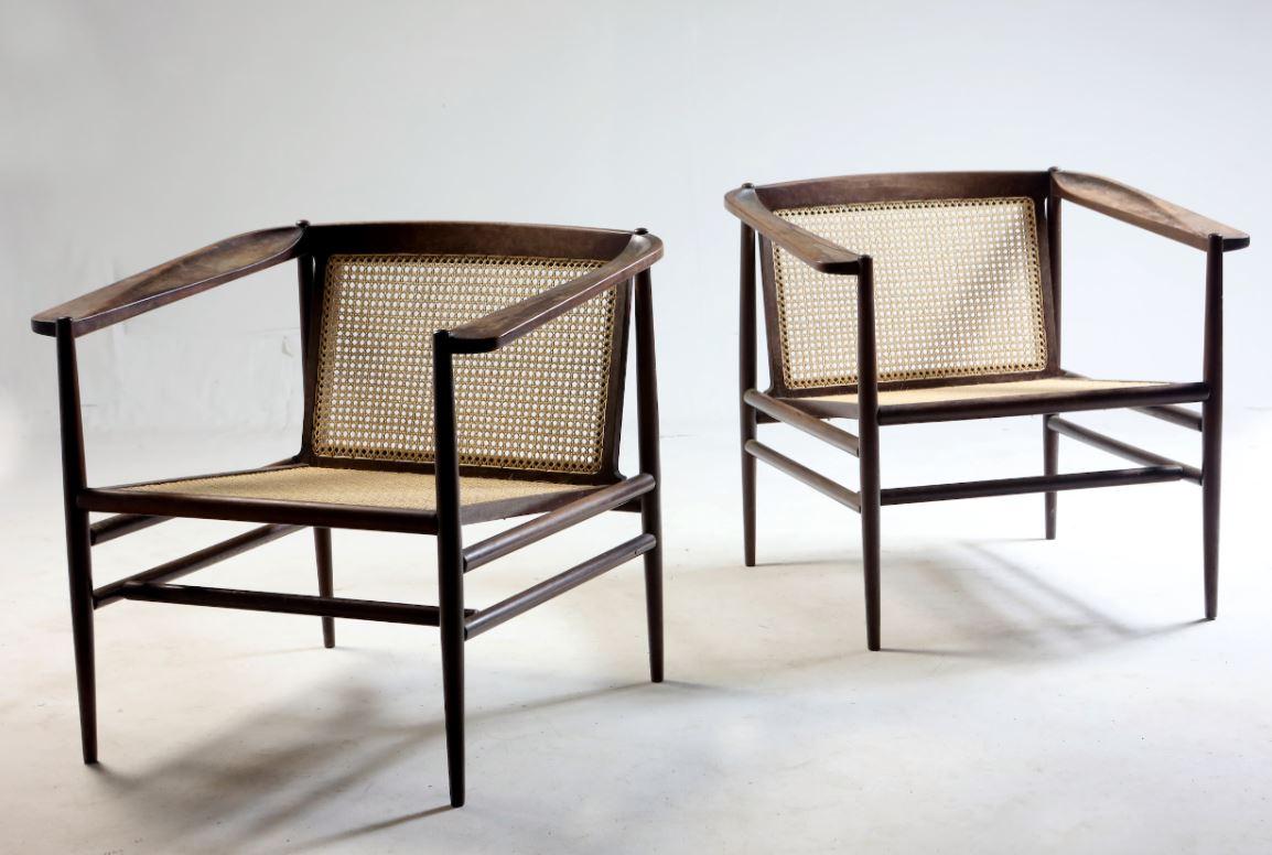 Iconic armchairs designed by Joaquim Tenreiro in 1958.

These armchairs have been sourced directly from a private collection in Rio de Janeiro.

Photos of them in their original conditions (cane and wood) are available upon request,