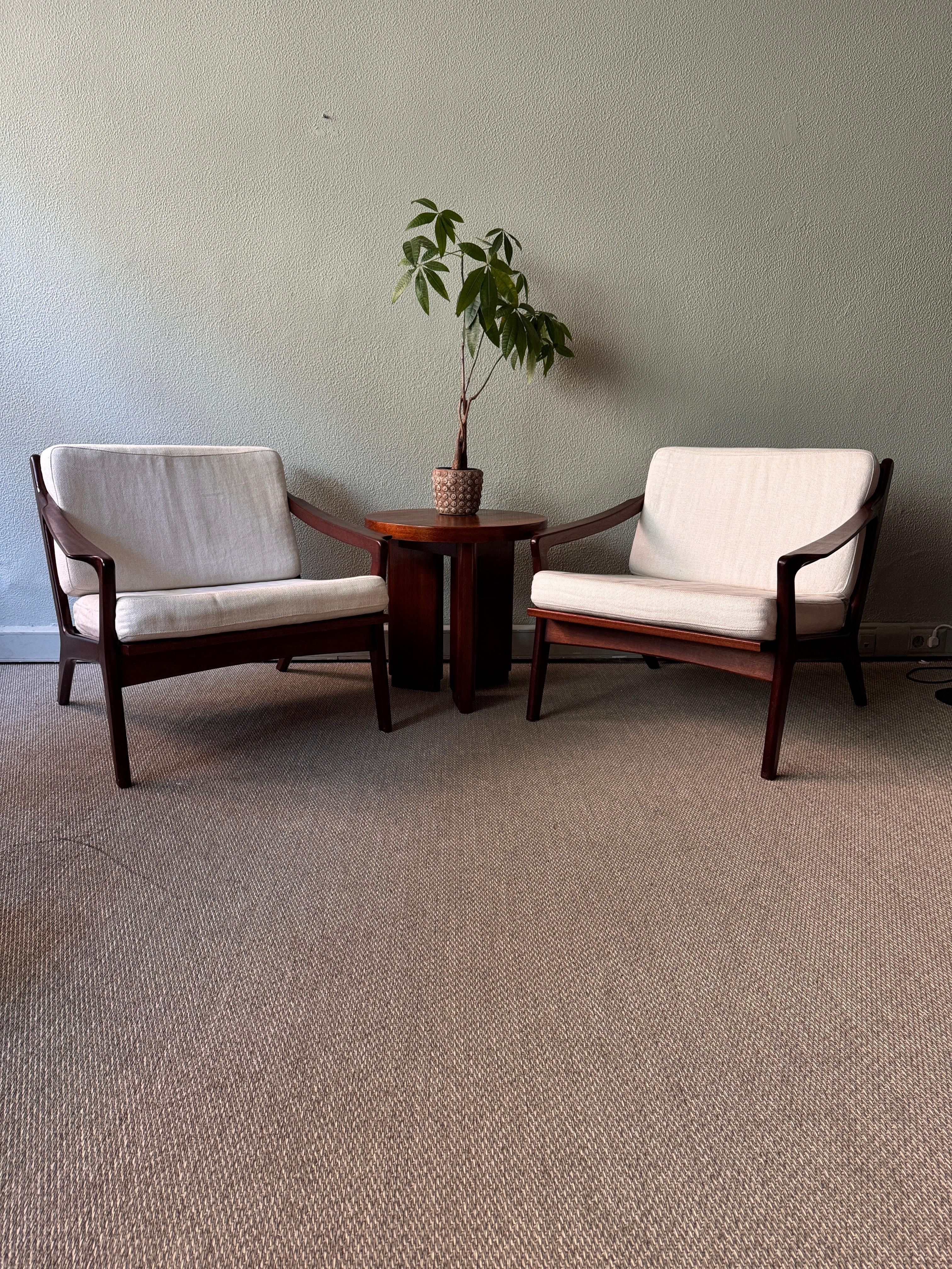 Designed by renowned Portuguese architect José Cruz de Carvalho for Altamira in the 1960s, this elegant pair of armchairs exemplifies the quiet sophistication of mid-century Portuguese design, enriched with a subtle touch of streamline modernism.