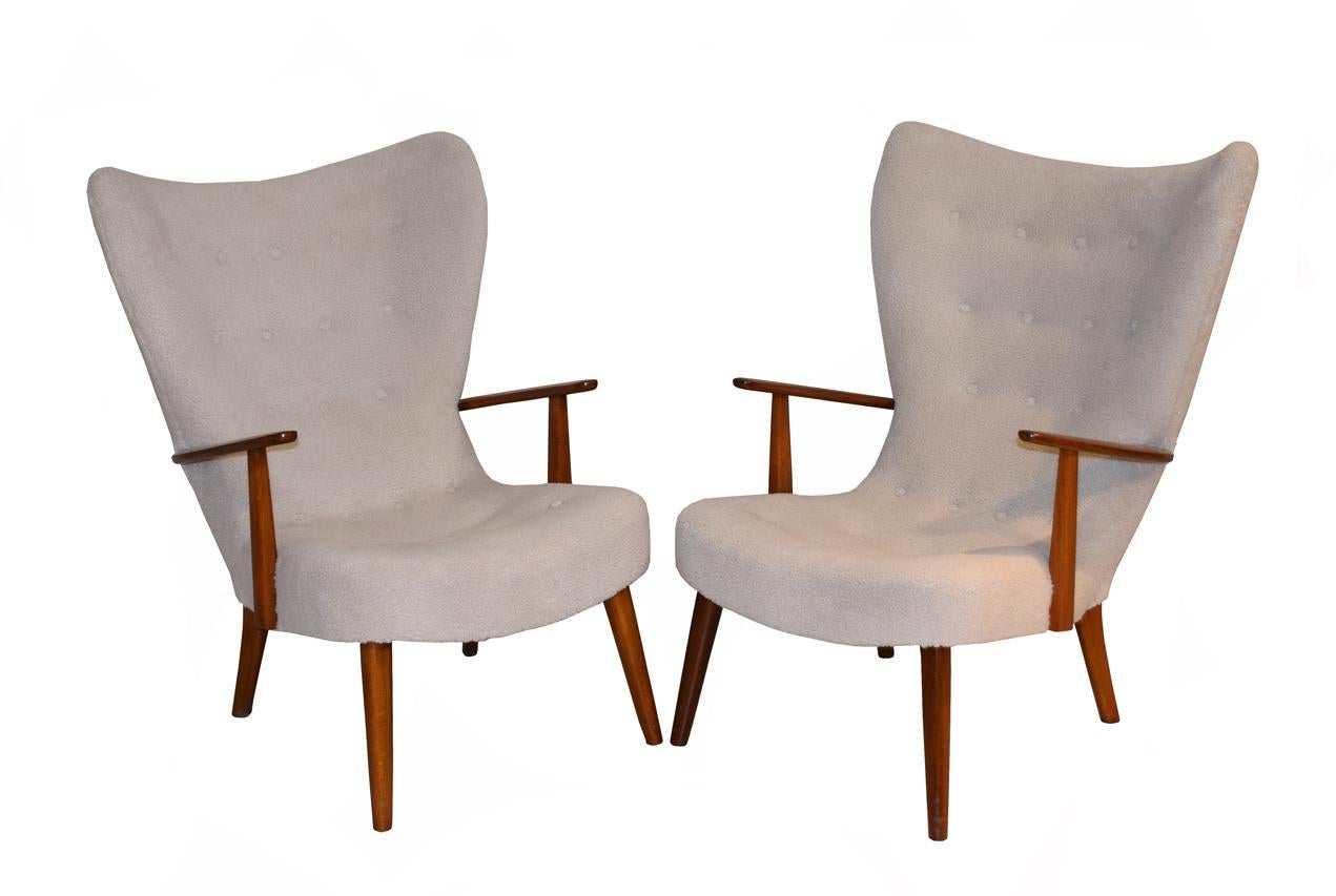 Pair of lounge chairs by Danish designers, Ib Madsen & Acton Schubell, from 1950's 
Elegant, stylish and comfortable. Recovered in an off-white boucle fabric.