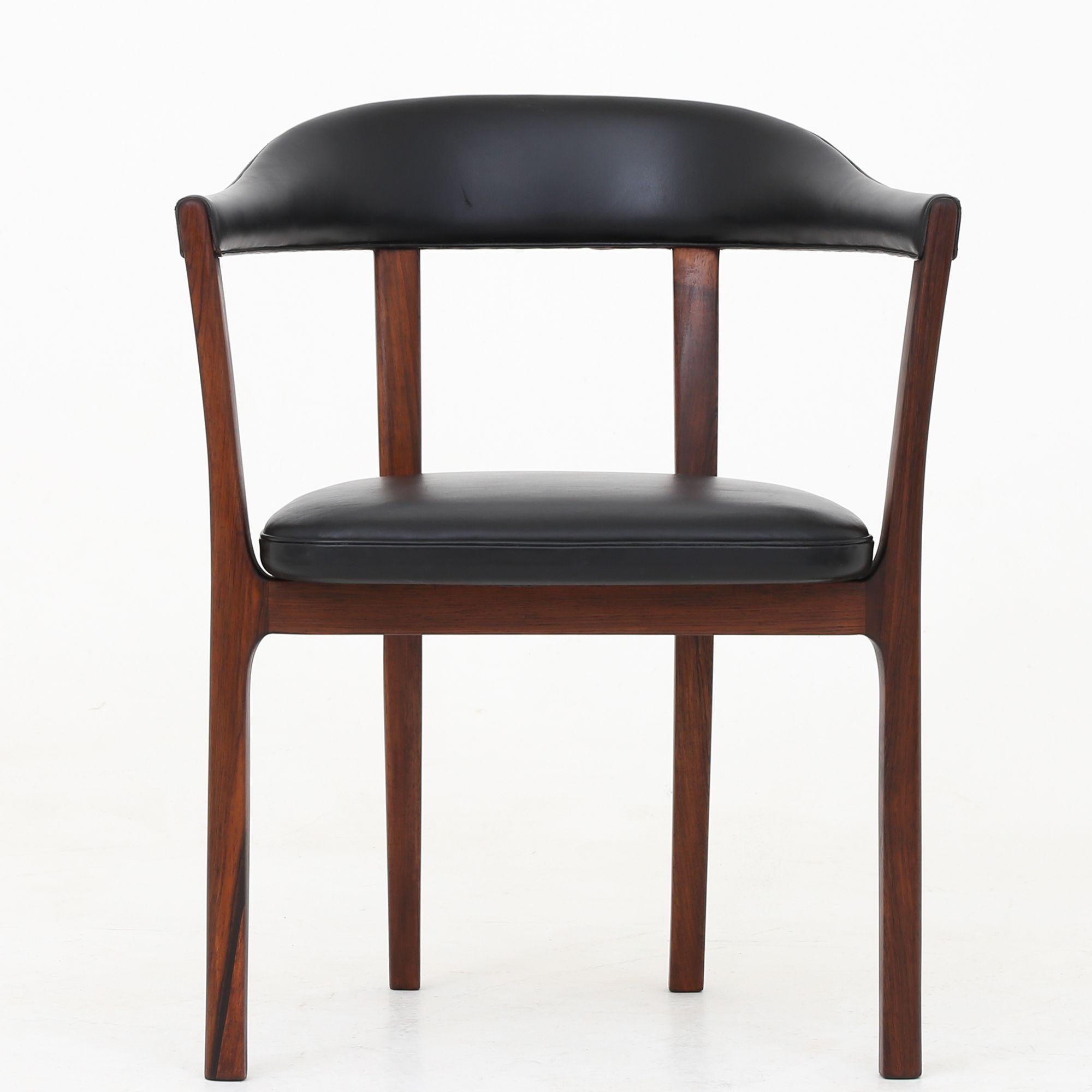 Two rare armchairs in rosewood and black leather. Model J2833. Designed in 1958. Ole Wanscher / A. J Iversen.