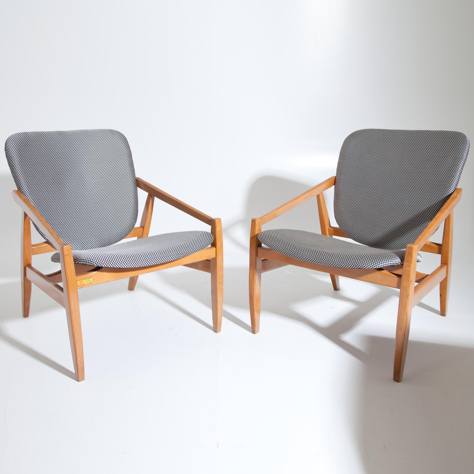 Pair of armchairs by Pizzetti, newly upholstered in grey fabric with rhombic pattern. They are labeled at the bottom, one chair also on the front rail.