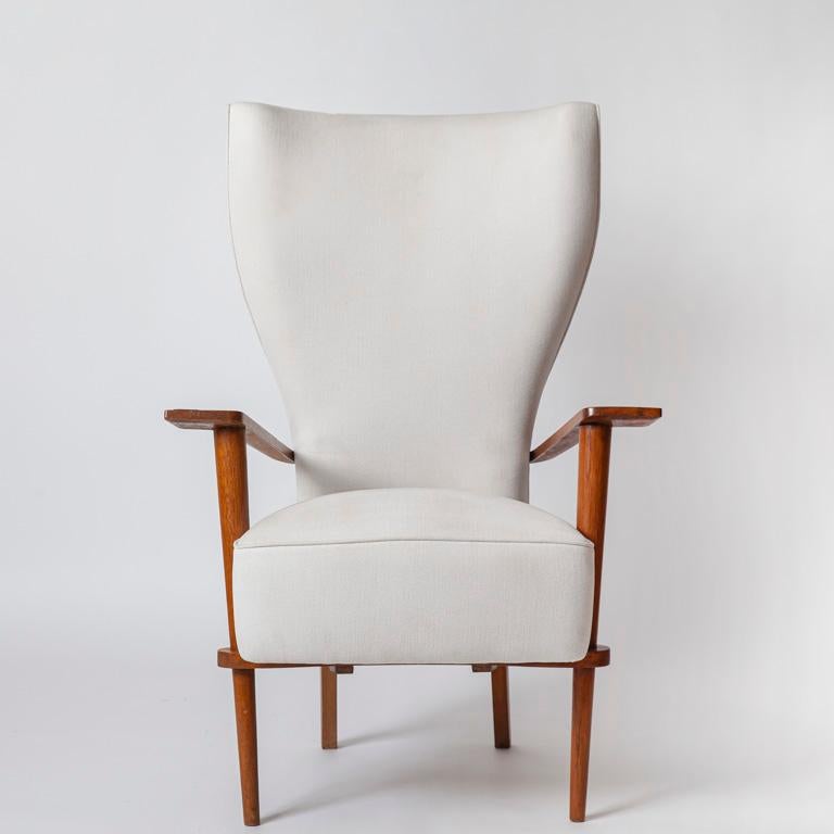 Pair of Armchairs by Italian Architect Renzo Zavanella, c. 1950, in oak with brass details, original inventory labels to underside. 
Born in Mantua in 1900, Renzo Zavanella (1900-1988) was a visionary Italian architect and designer whose new and