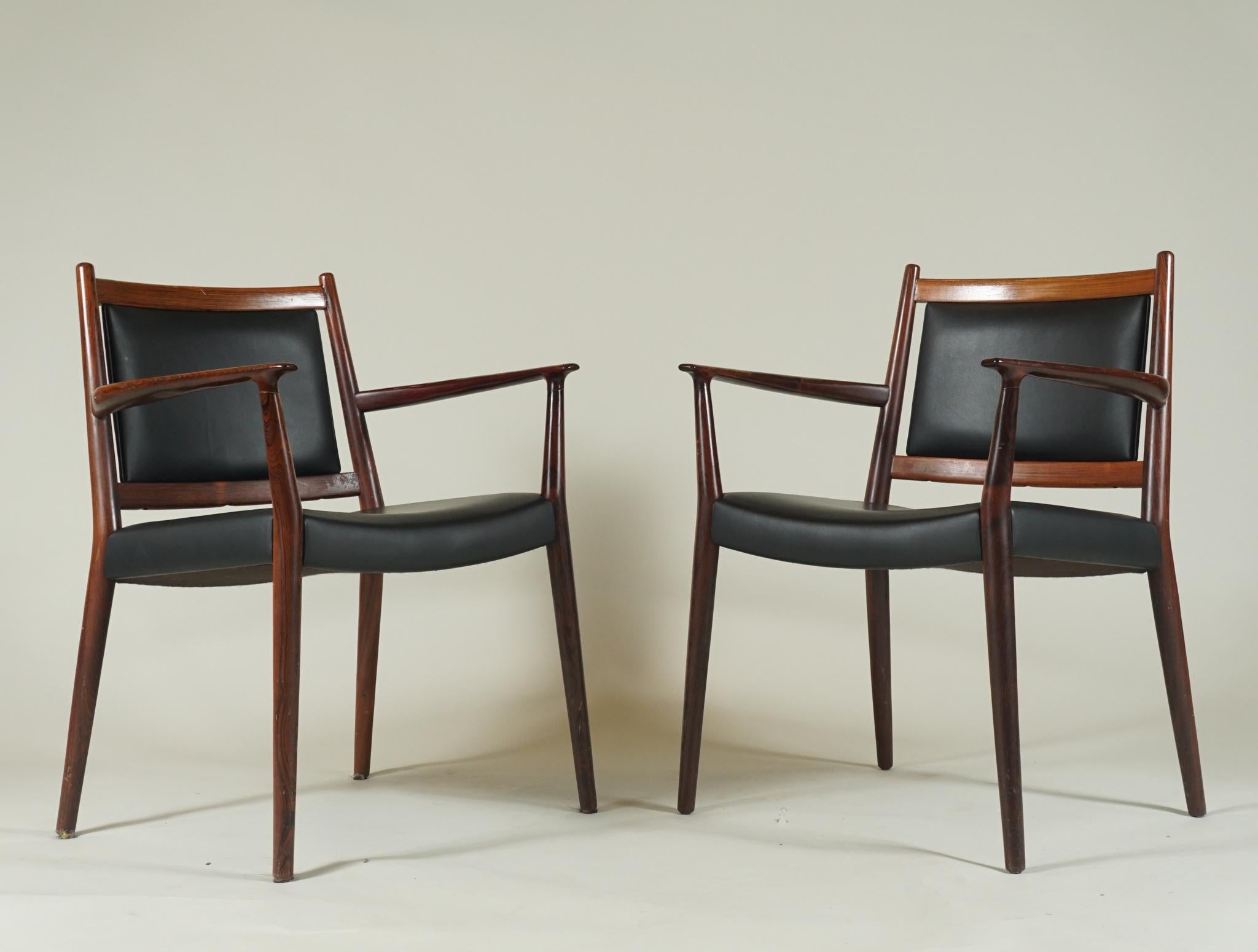 A handsome pair of rosewood armchairs, upholstered in black leather by Danish architect, Steffan Syrach
Larsen, Danish modern, very high quality. Polished rosewood and fine quality black leather. Perfect as
desk chairs or occasional armchairs.