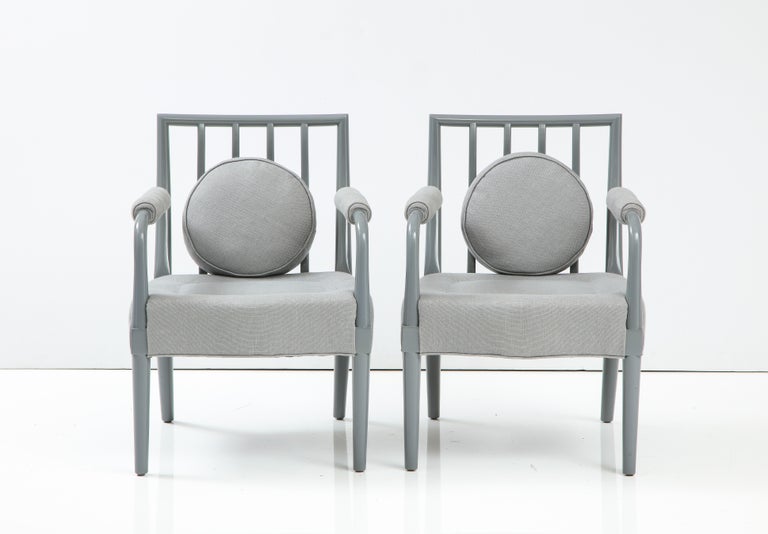 Pair of Armchairs by T.H. Robsjohn-Gibbings, United States, c. 1950. 

These handsome armchairs consist of solid wood frames, spindle backs, upholstered seats and armrests, and a single round back cushion.

Frame has been painted in a high gloss