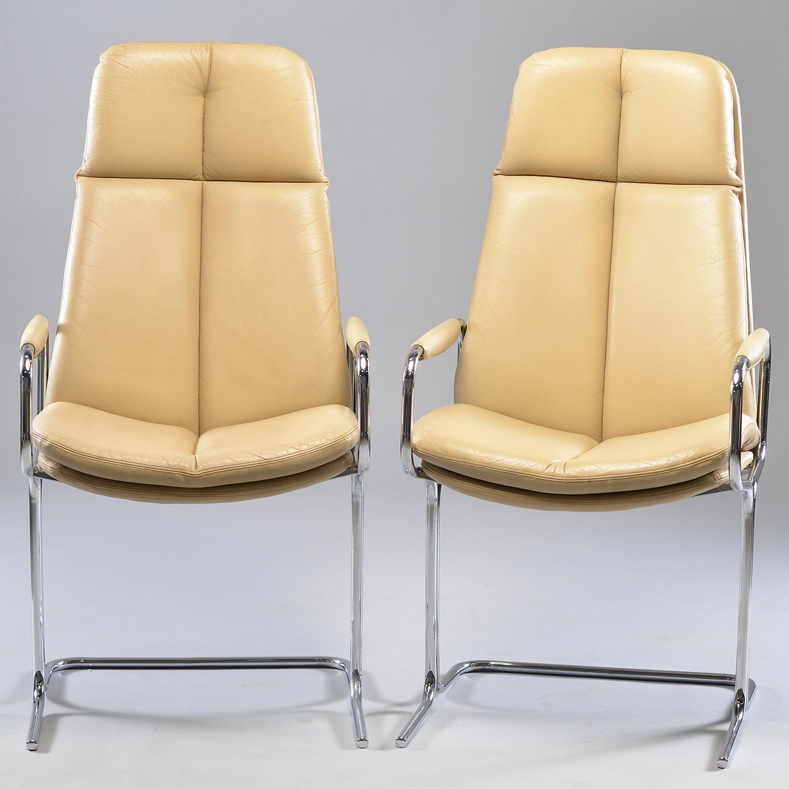 Pair of armchairs designed by Tim Bates for the Eleganza collection at Pieff, circa 1970s. Frames are made of tubular metal with chrome finish. Seats are ivory colored leather with high backs, slightly curved seats and padded armrests. Very good