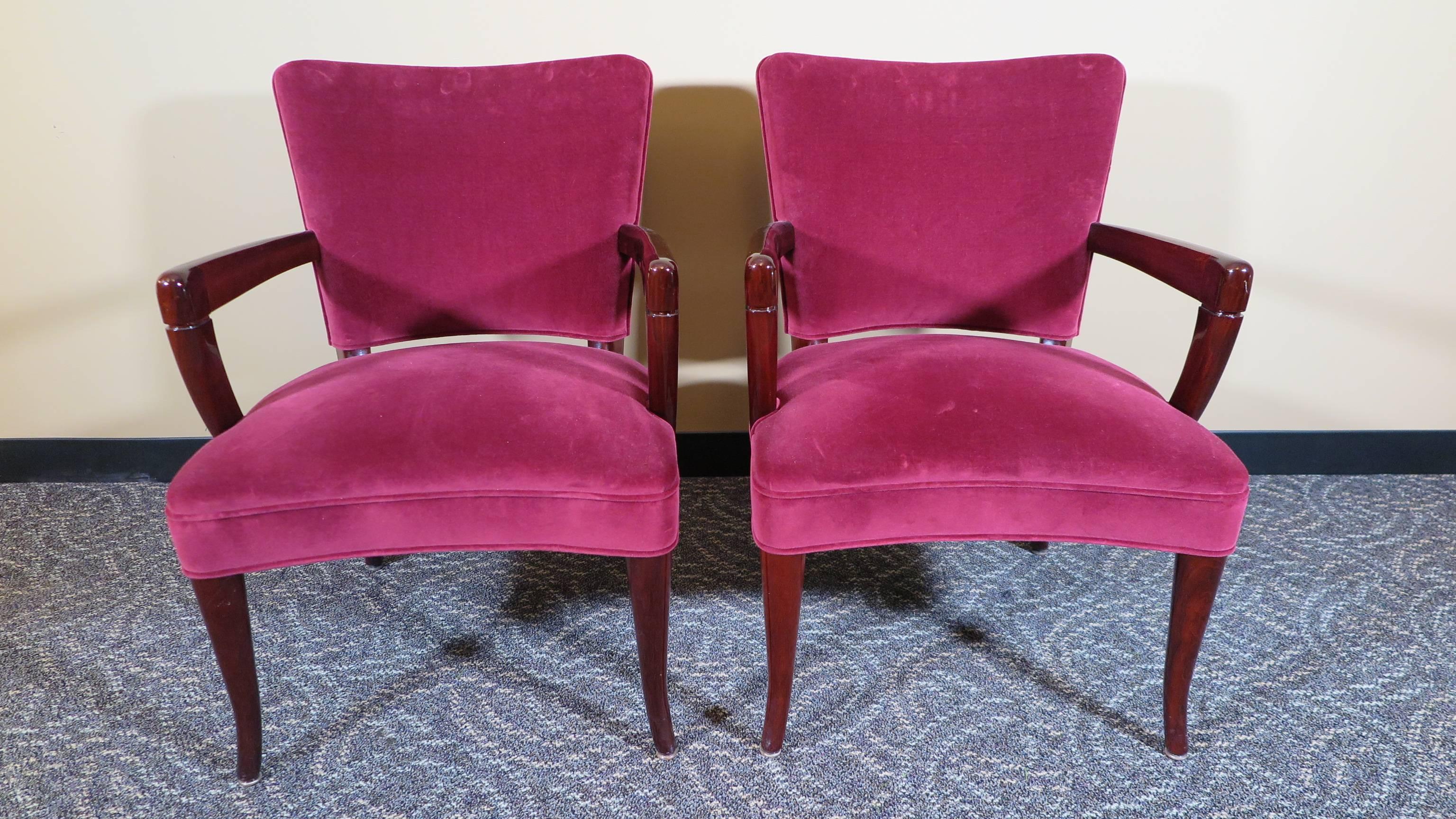 A pair of saber leg armchair by Widdicomb Furniture Company, 1940s. Widdicomb armchairs having saber legs and large out reaching arms in the style of Robsjohn-Gibbings. These chairs can be placed as they are, velvet fabric is in very good condition