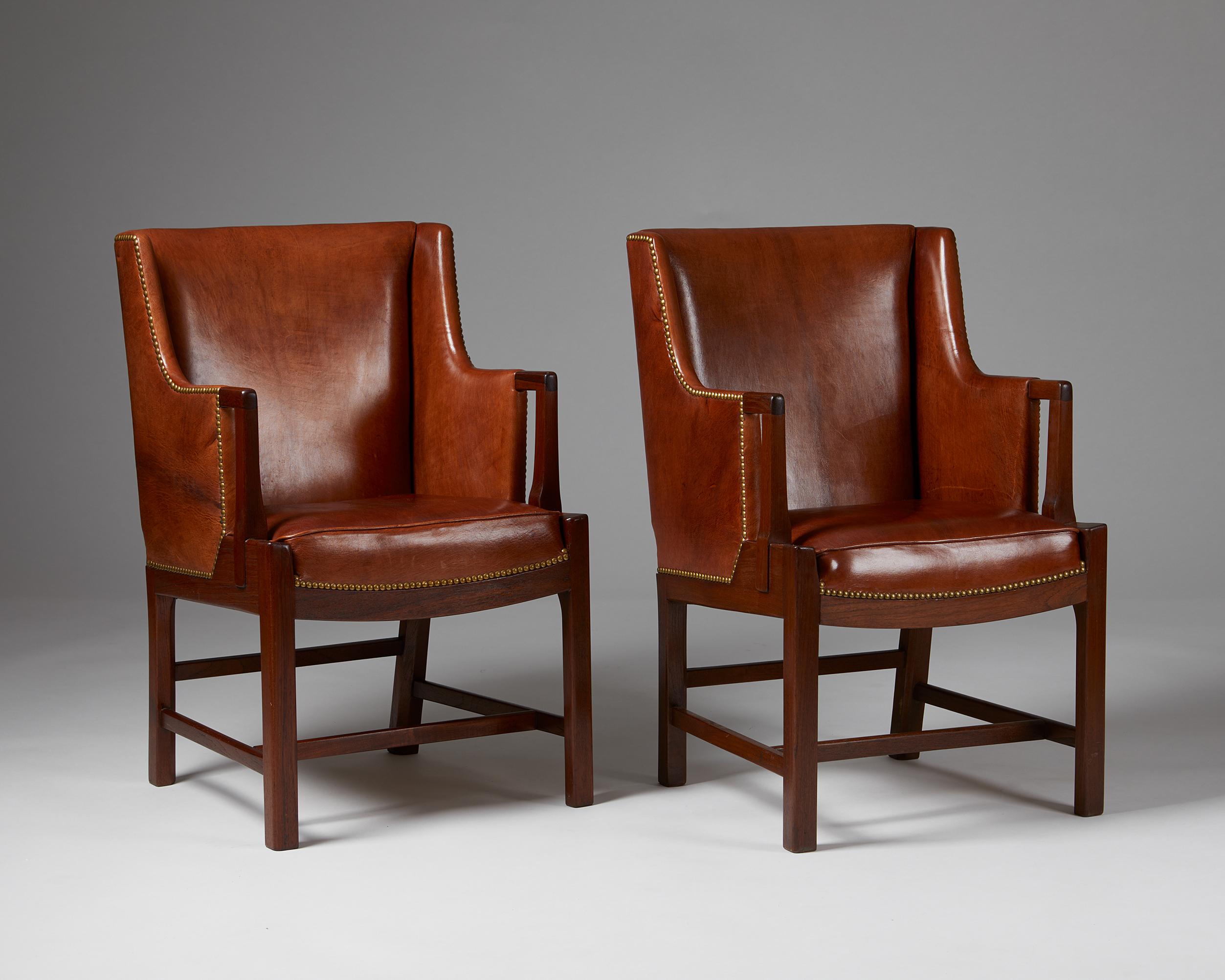 Pair of armchairs designed by Hans J. Wegner and Palle Suenson for C.B. Hansens Etablissement,
Denmark. 1940s.
Mahogany, Niger leather and brass.

This chair model from the 1940s was collaboratively realised by two of Denmark’s most influential