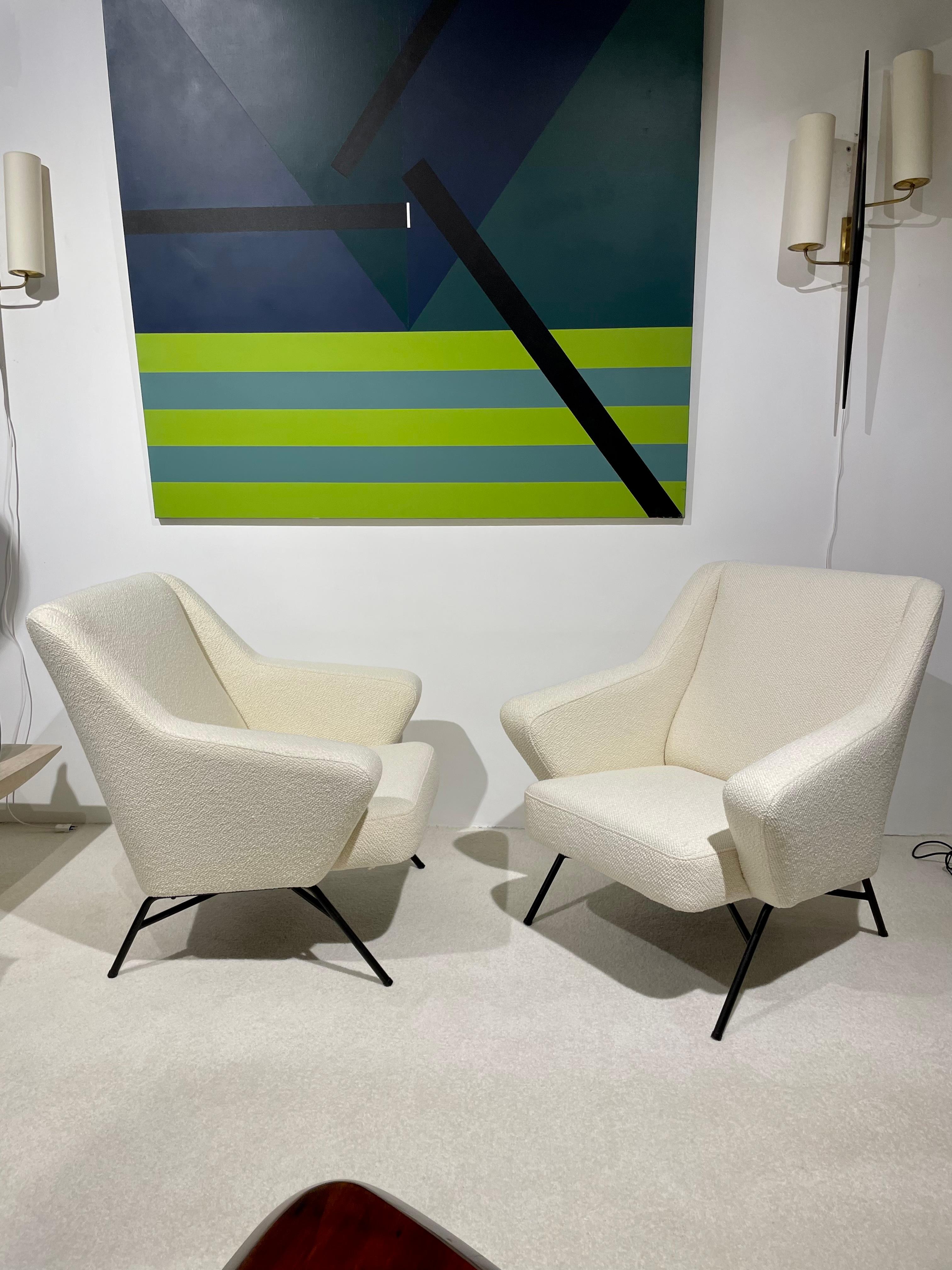 Pair of armchairs with triangular armrests
 ed. burov
 France, Circa. 1950
 Description: Tubular base in black lacquered metal, seat and back upholstered with foam covered with a mottled gray fabric from the house Lelievre.