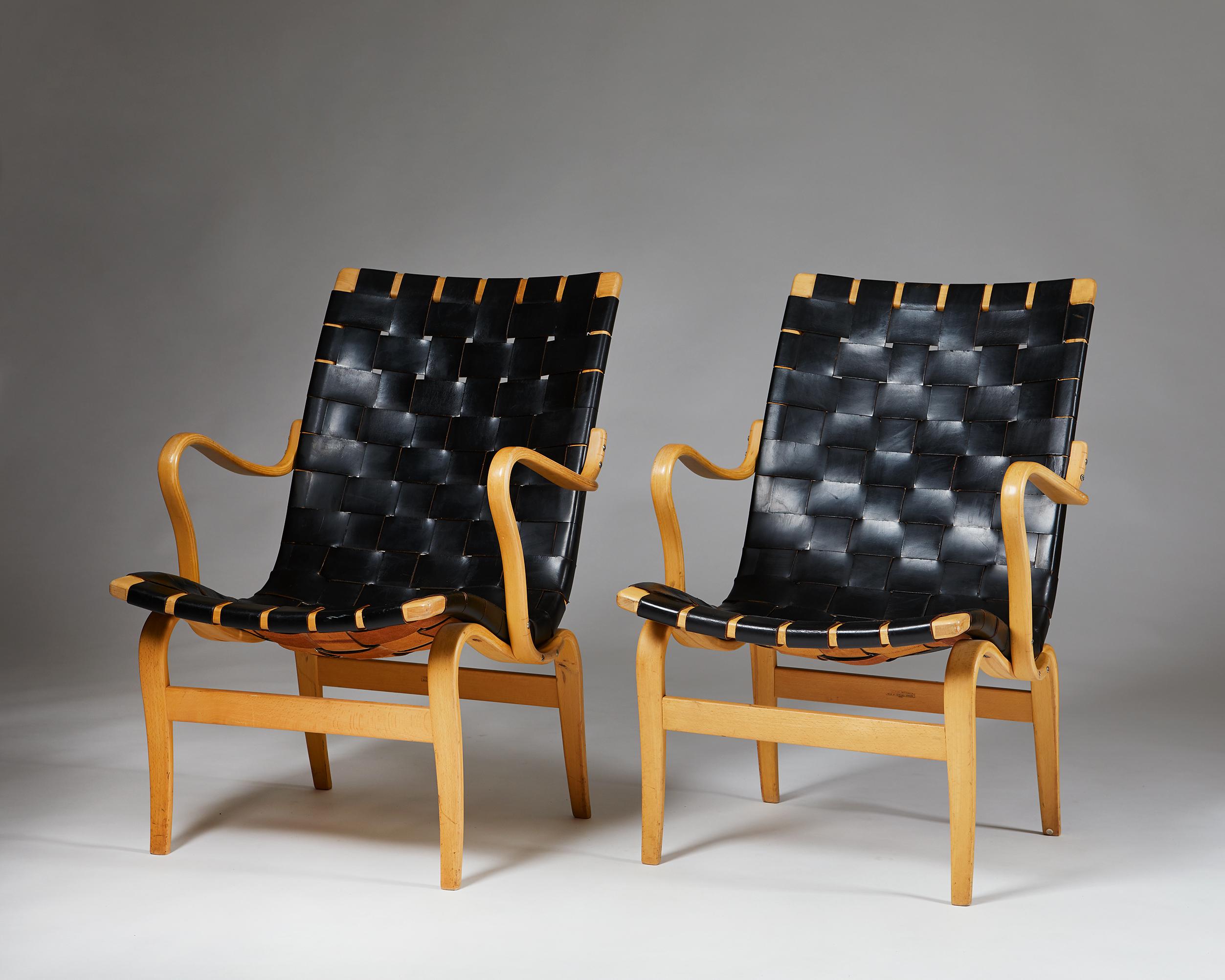 Pair of armchairs Eva designed by Bruno Mathsson for K. Mathsson, 
Sweden, 1960s.

Wreathed leather seat on a beech bentwood frame.

Measures: H: 84 cm/ 2' 9 1/2