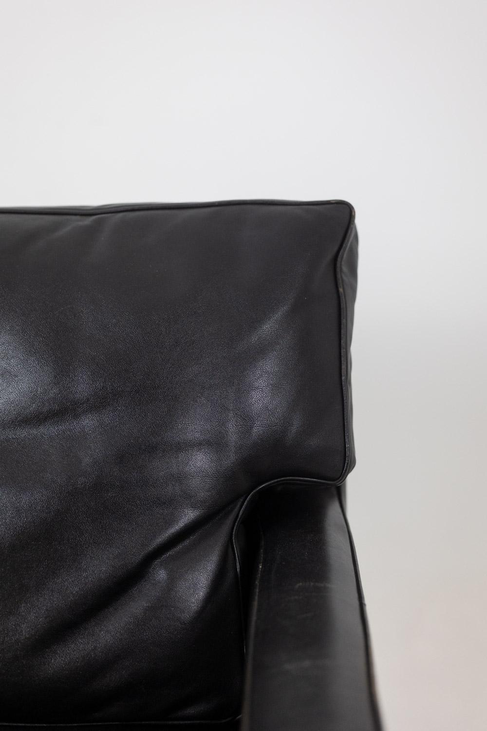Metal Pair of armchairs in black leather and chrome metal. 1970s. For Sale