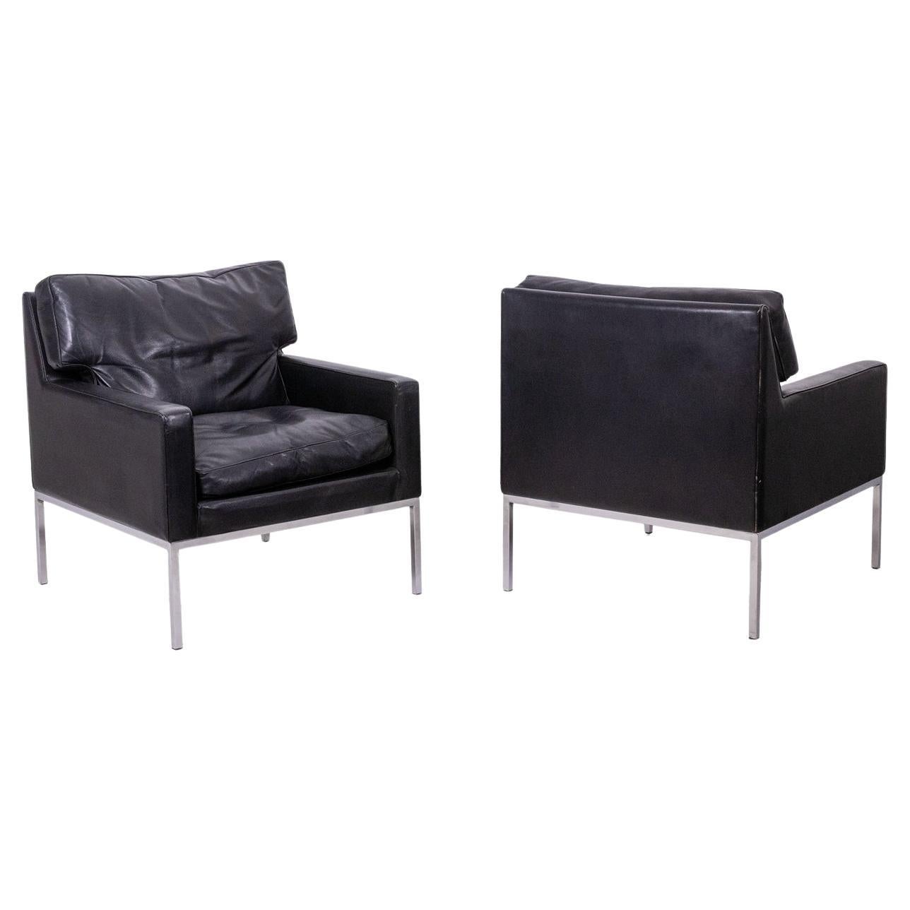Pair of armchairs in black leather and chrome metal. 1970s.