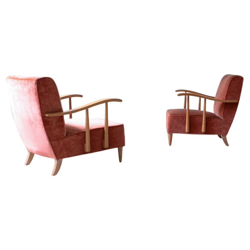 Pair of armchairs in blond wood and padded fabric.