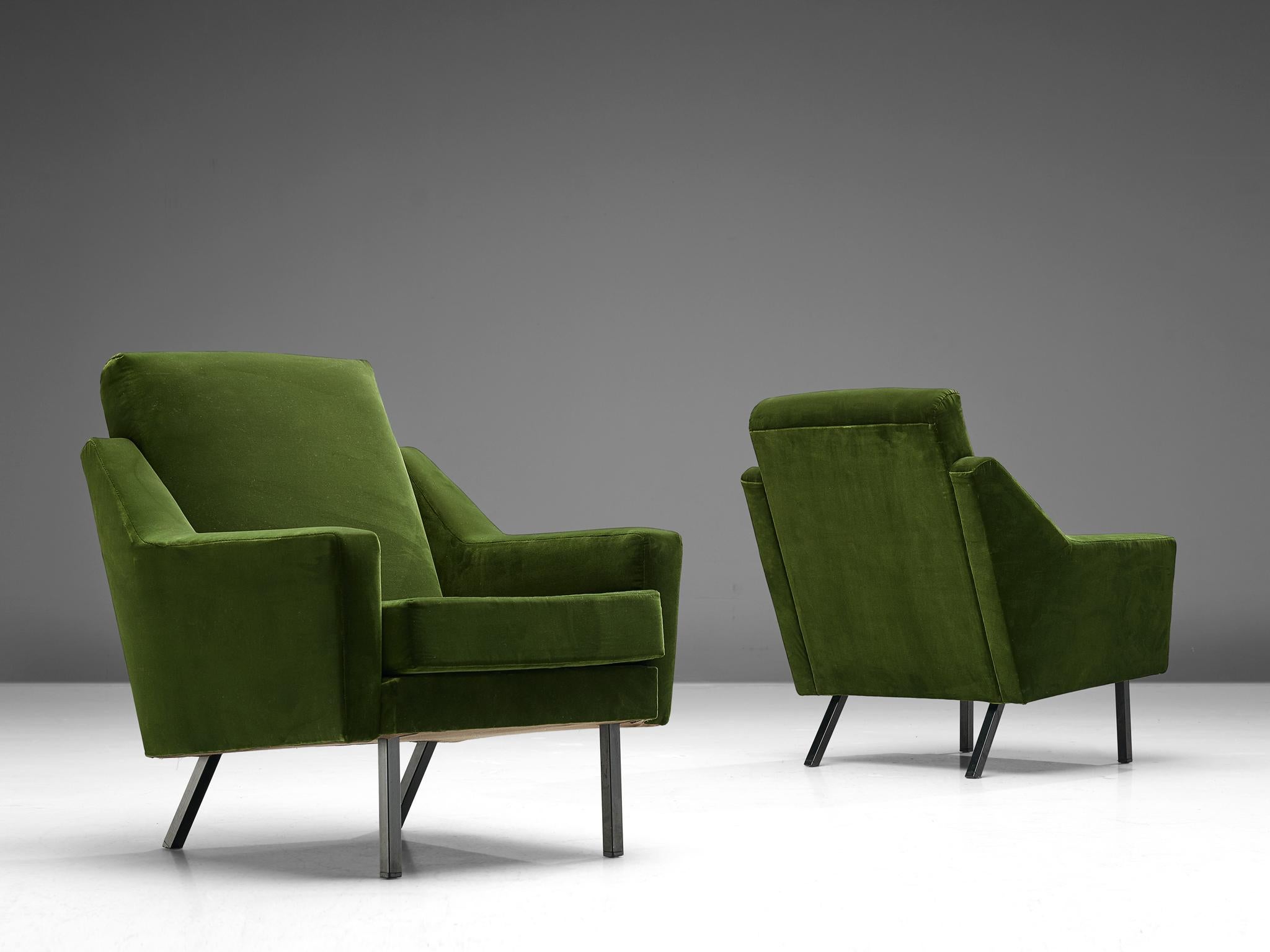 Pair of lounge chairs, green colored velvet and lacquered metal, Europe, 1960s.

Set of two armchairs with beautiful designed frame with straight lines in green colored velvet upholstery. The seating is slightly tilted to give the chair an