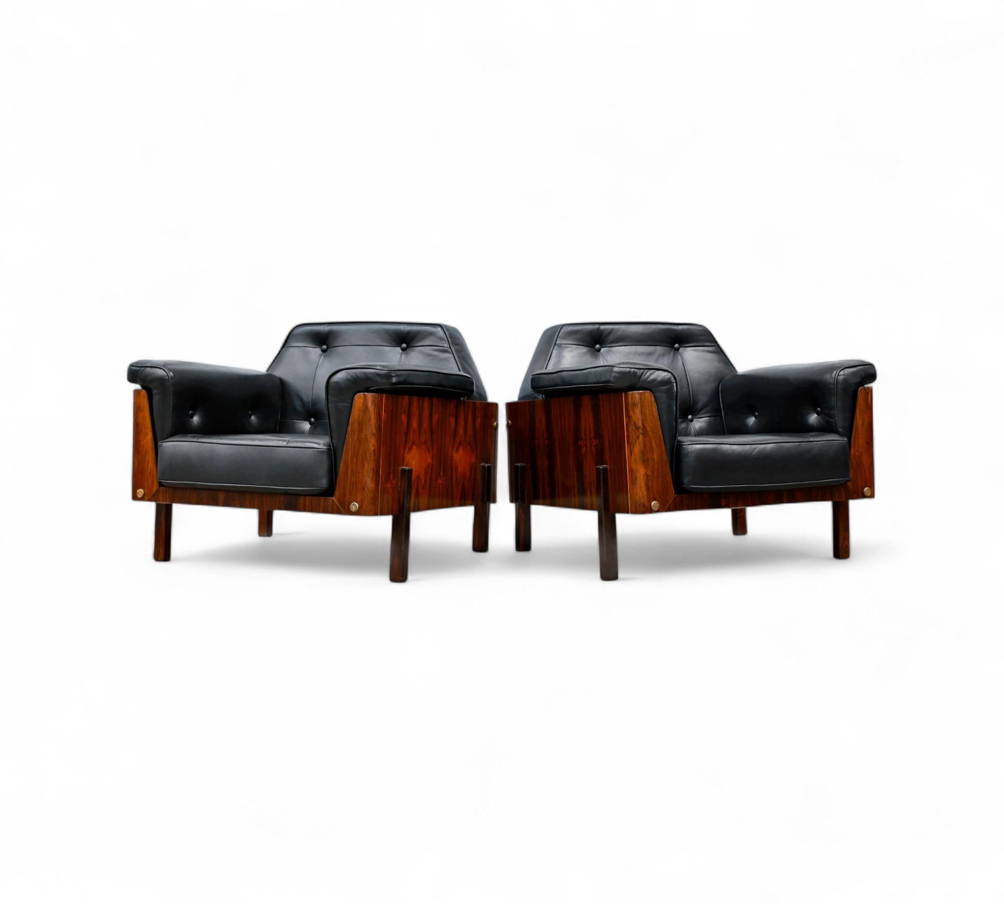 These unique looking armchairs feature a square base made in Brazilian Hardwood (Jacaranda). They have been upholstered in black leather and the back seat has been tufted with four buttons. The structure of the backseat has an incredible design