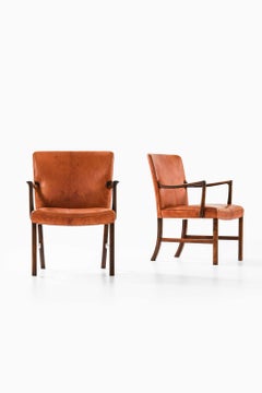 Par de sillones de piel y palisandro de Ole Wanscher, década de 1950