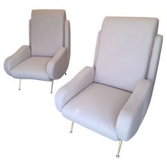 Coppia di poltrone in tessuto beige chiaro