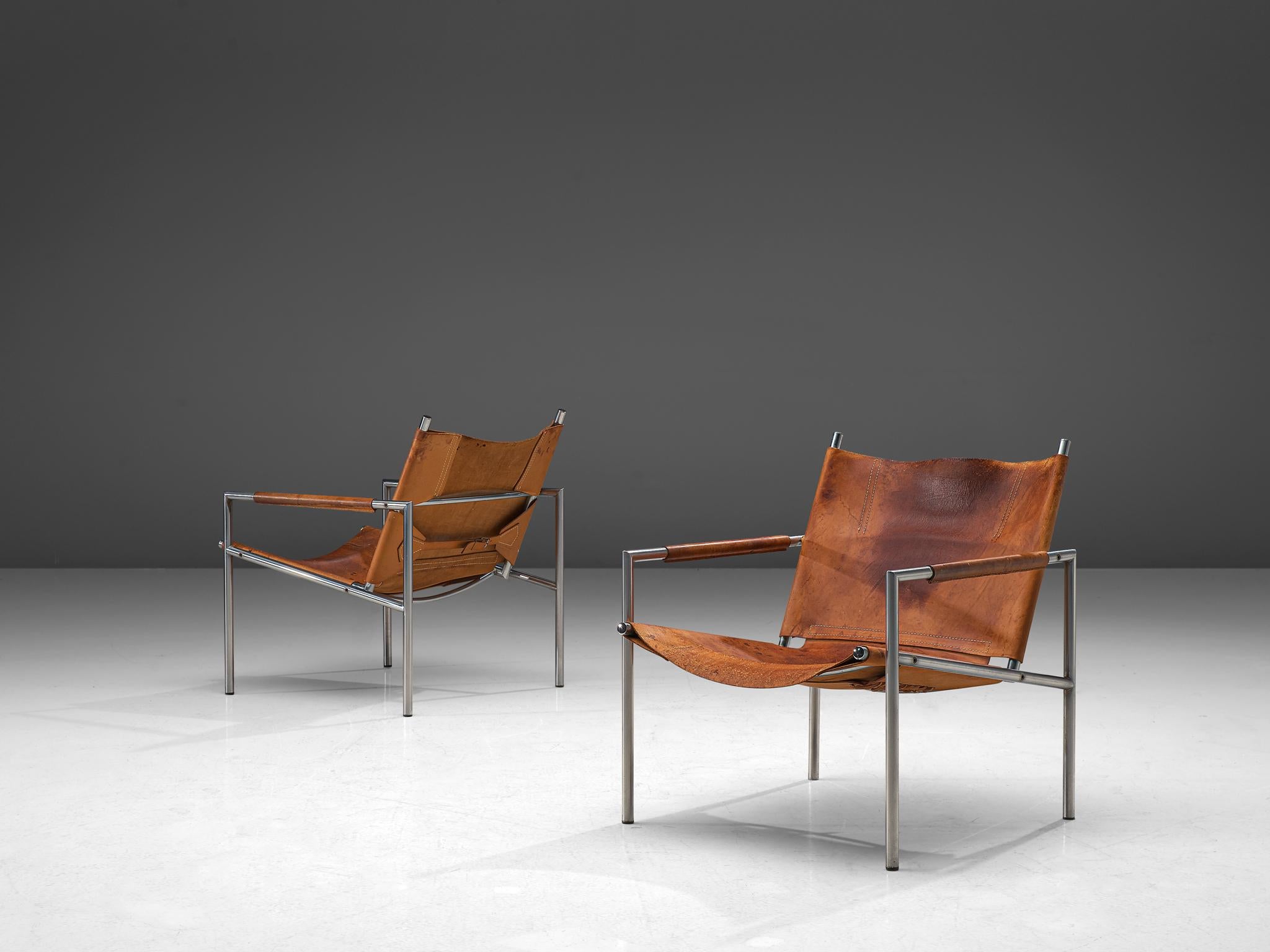 Martin Visser, pair of armchairs, leather and metal, The Netherlands, 1965.

These modern, Minimalist easy chairs are made of a tubular brushed steel in combination with soft, patinated cognac leather upholstery. The armrests are covered in cognac