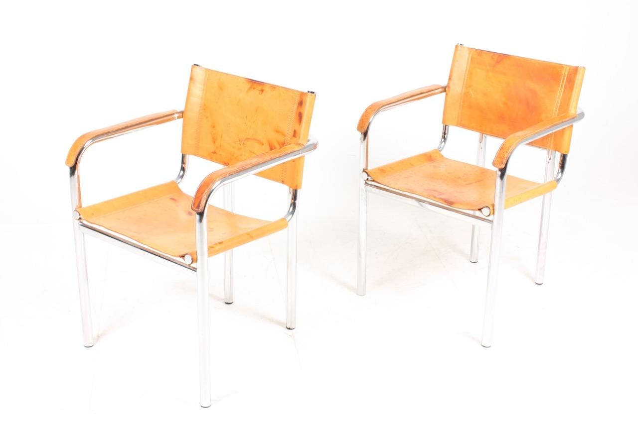 Pair of armchairs in patinated leather. Designed and made in Italy in the 1980s. Great original condition.