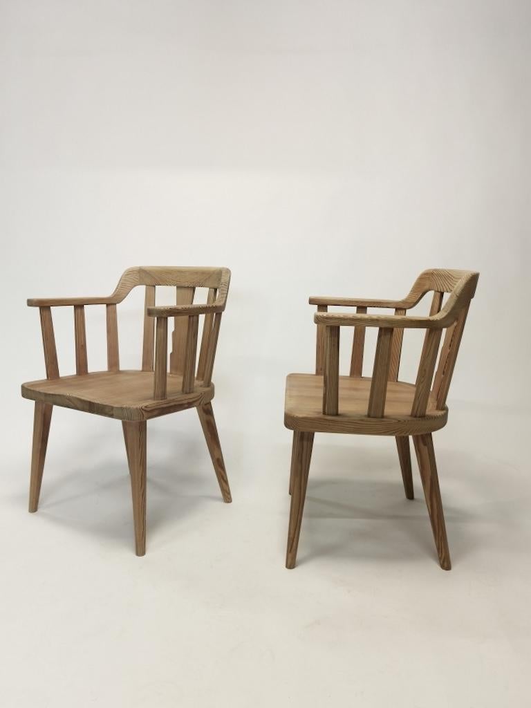 A pair of Nordic pinewood armchairs by Nordiska Kompaniet.
Model 