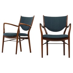 Paire de fauteuils en bois de rose et tissu original de Finn Juhl, 1946