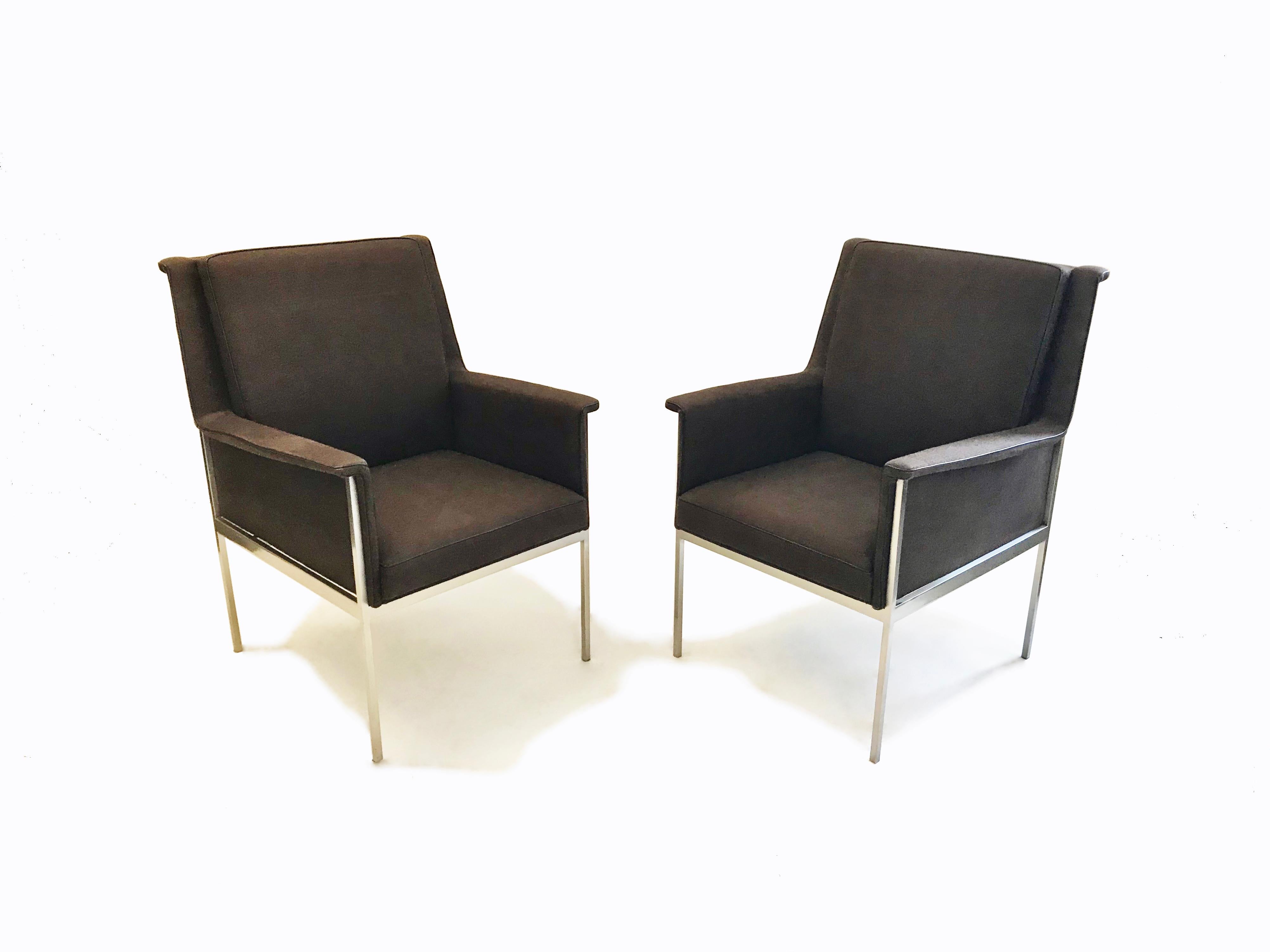 Pair of desk or side armchairs that have a a slightly fanned design at the back seat’s top edge and arms, a brushed nickel plated frame, legs that are 1.5 cm square wide, side stretchers that are 3.5 cm square wide, and seats reupholstered in thick