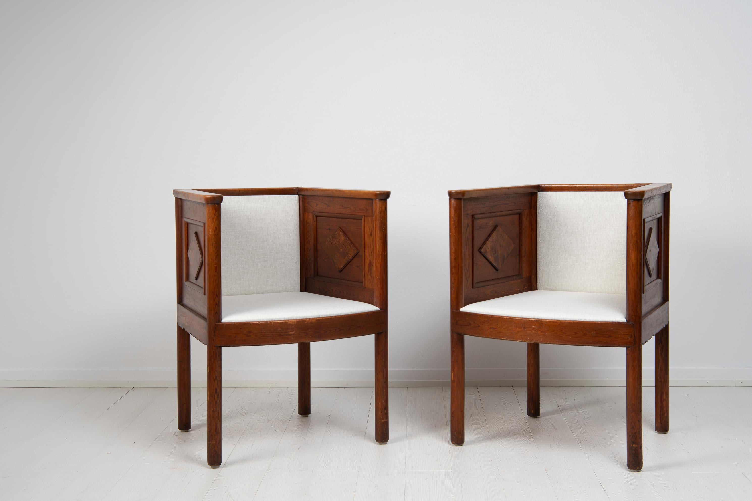 Pair of pine armchairs in the style of Axel Einar Hjorth from Sweden. The armchairs are from the 1920s to 1930s. The designer and maker of these are unknown however they are in the characteristic style of Axel Einar Hjorth. The chairs are a so
