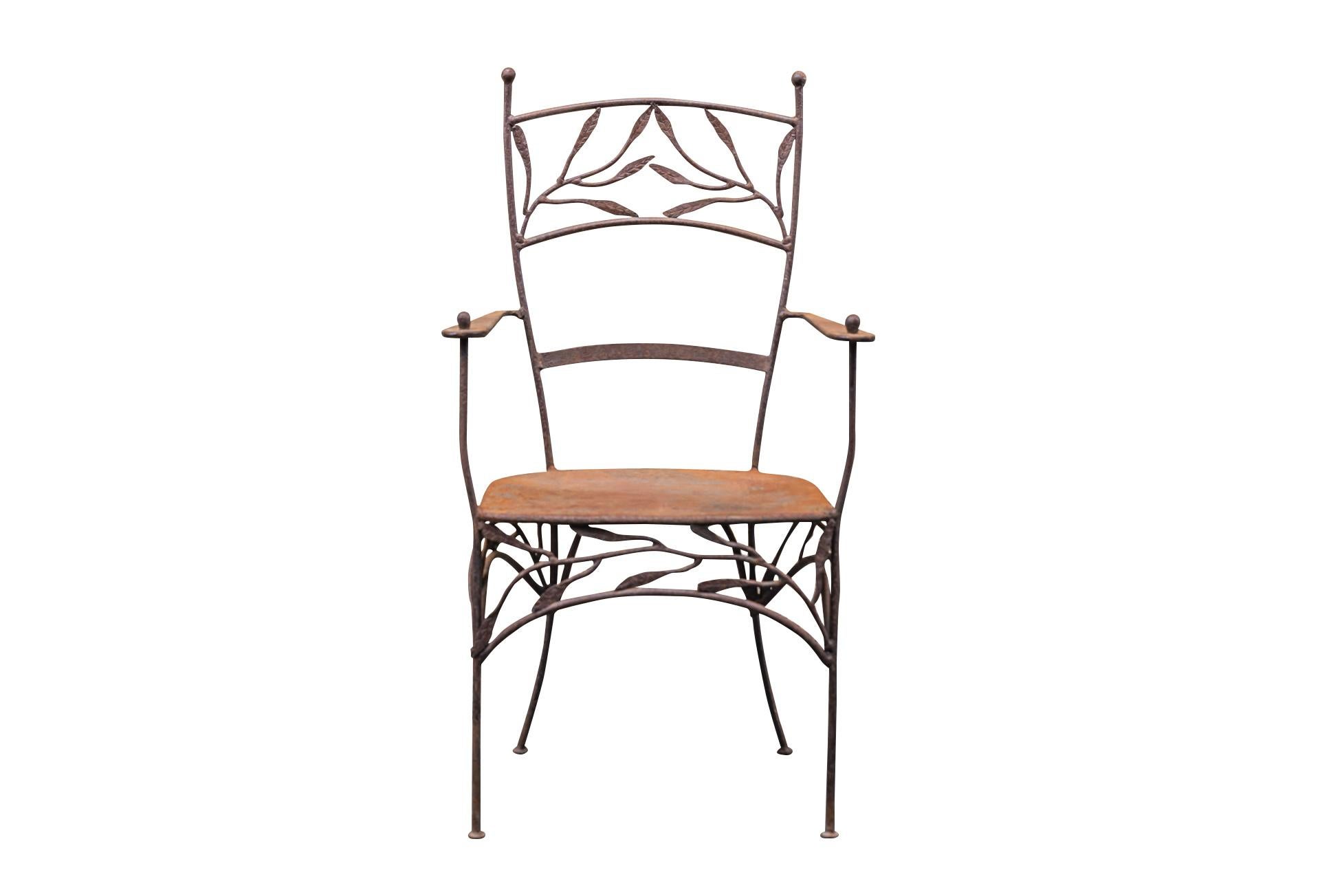 Pair of armchairs in the style of Lalanne,
Wrought iron with foliage decoration on the backrest and around the seat,
Slightly arched hind feet,
circa 1970, France.

Measures : Width 56 cm, depth 45 cm, height 102 cm.