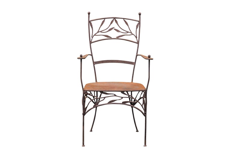 Pair of armchairs in the style of Lalanne,
Wrought iron with foliage decoration on the backrest and around the seat,
Slightly arched hind feet,
circa 1970, France.

Measures : Width 56 cm, depth 45 cm, height 102 cm.
