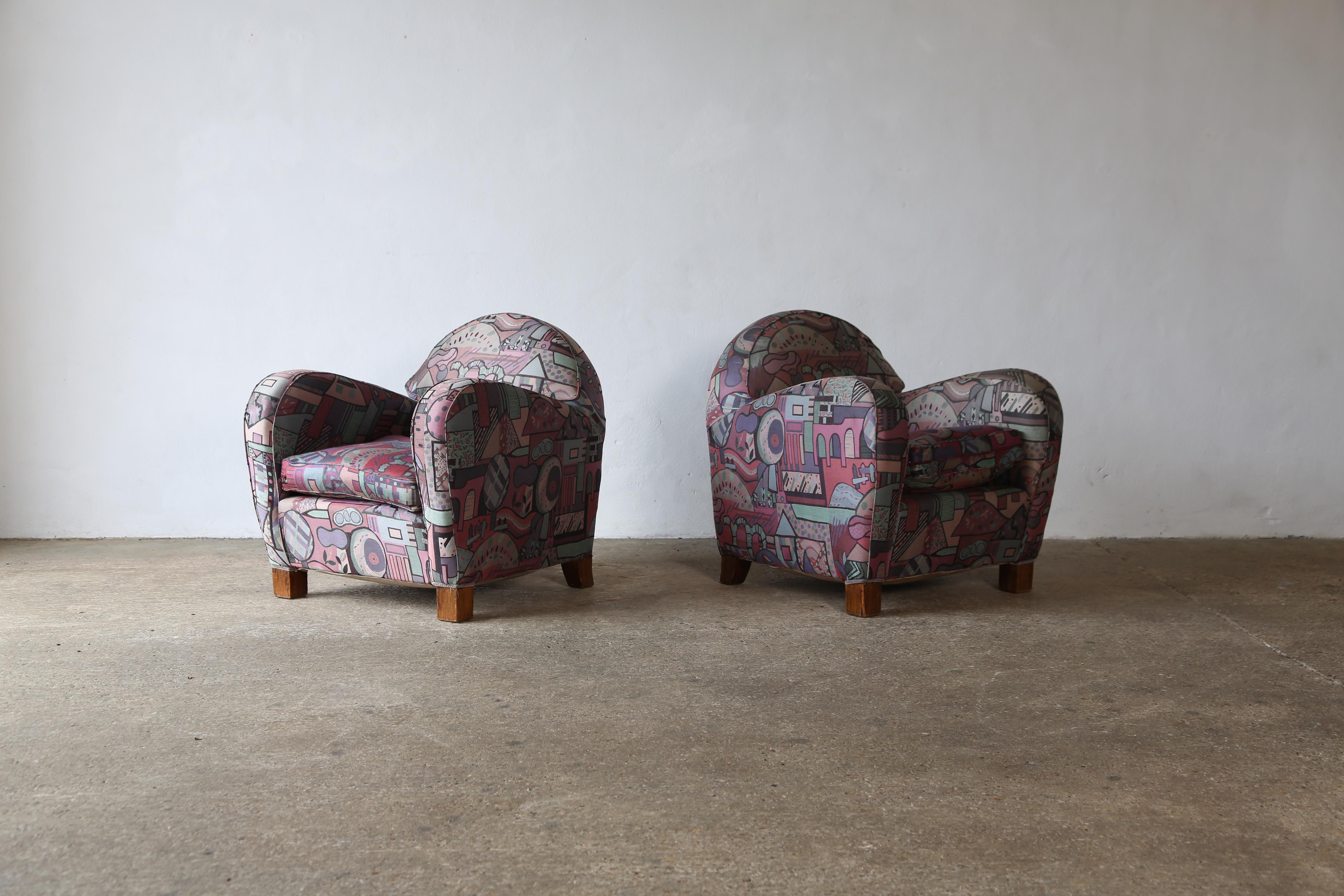 A shapely pair of armchairs, Italy, 1960s.   Later fabric.   Structurally sound. Can be used as are or suitable for reupholstery.  Fast shipping worldwide.
  
