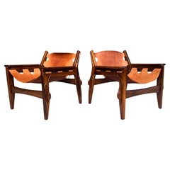 Coppia di poltrone "Kilin" in legno duro e pelle di Sergio Rodrigues, 1960 ca.