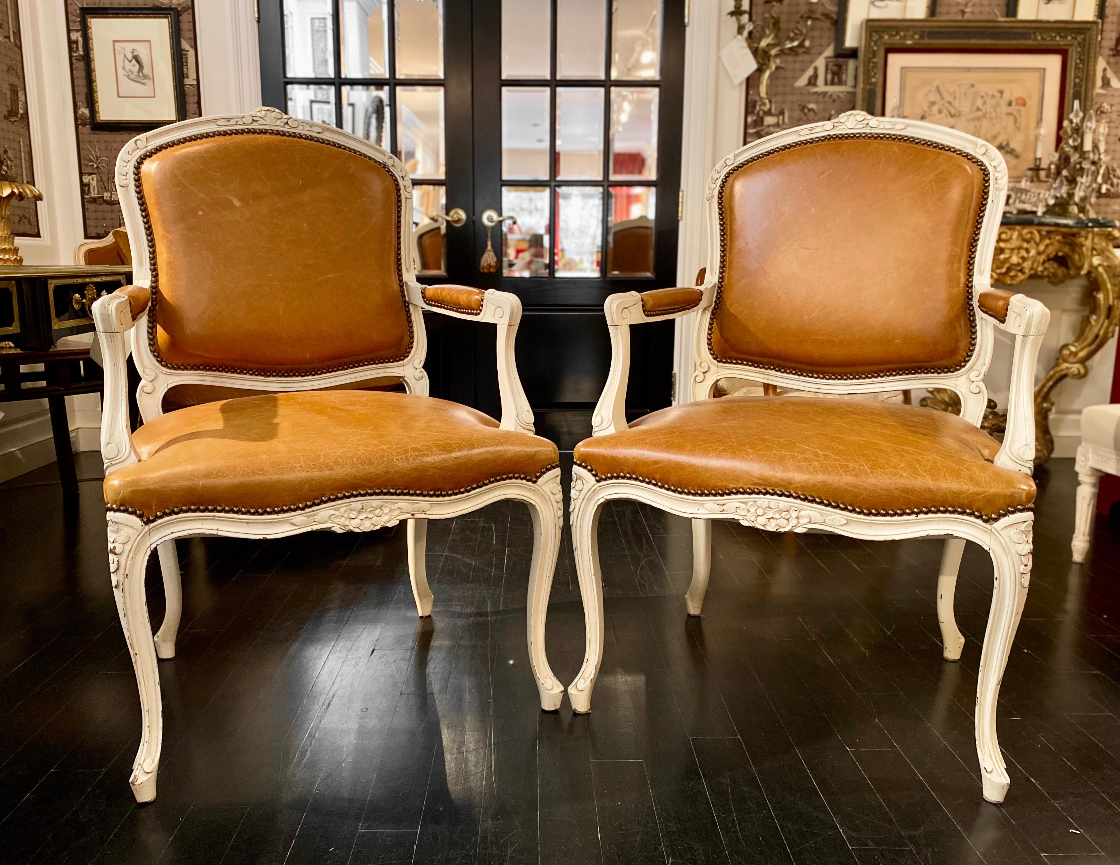 Pair of Armchairs, Louis XV Montespan style, newly upholstered in soft caramel/tan leather.