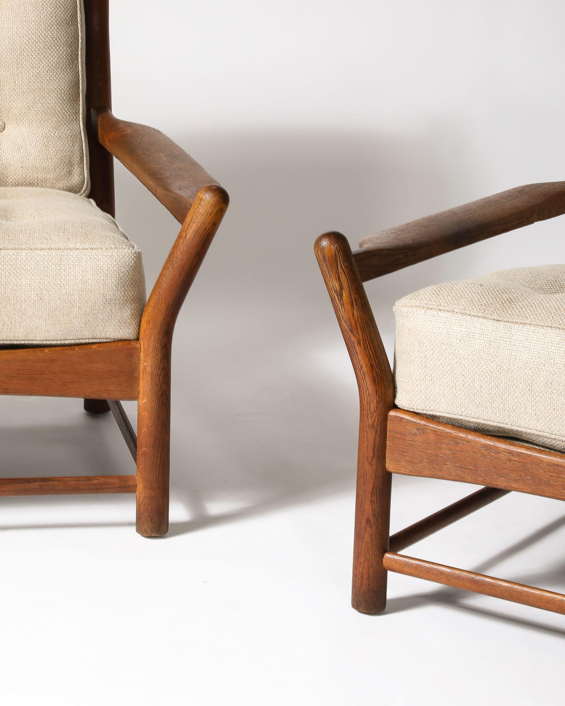 Handmade armchairs with new linen upholstery. These were sourced in France, but we're unsure of the maker.