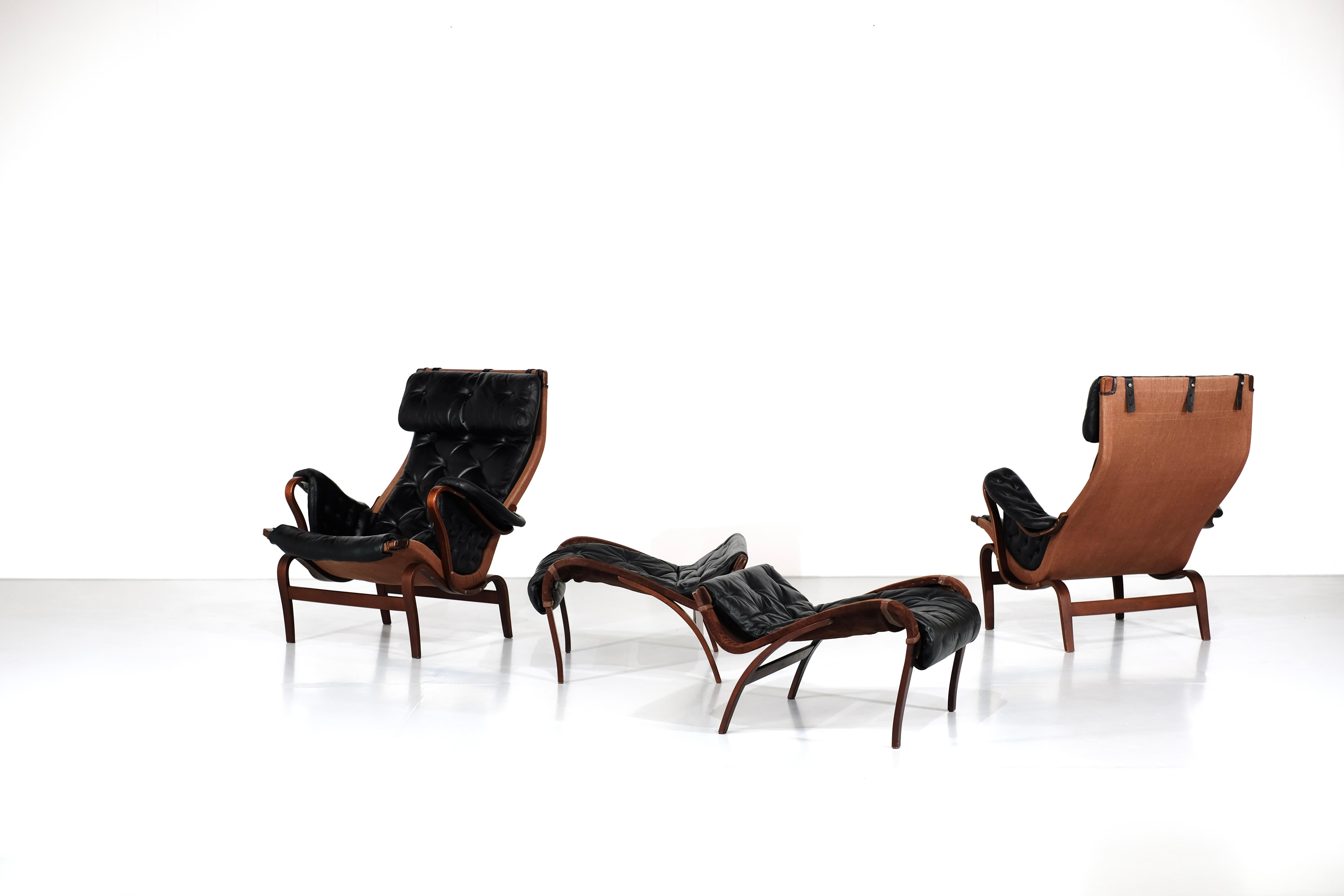 Pair of Armchairs and Ottompans model 