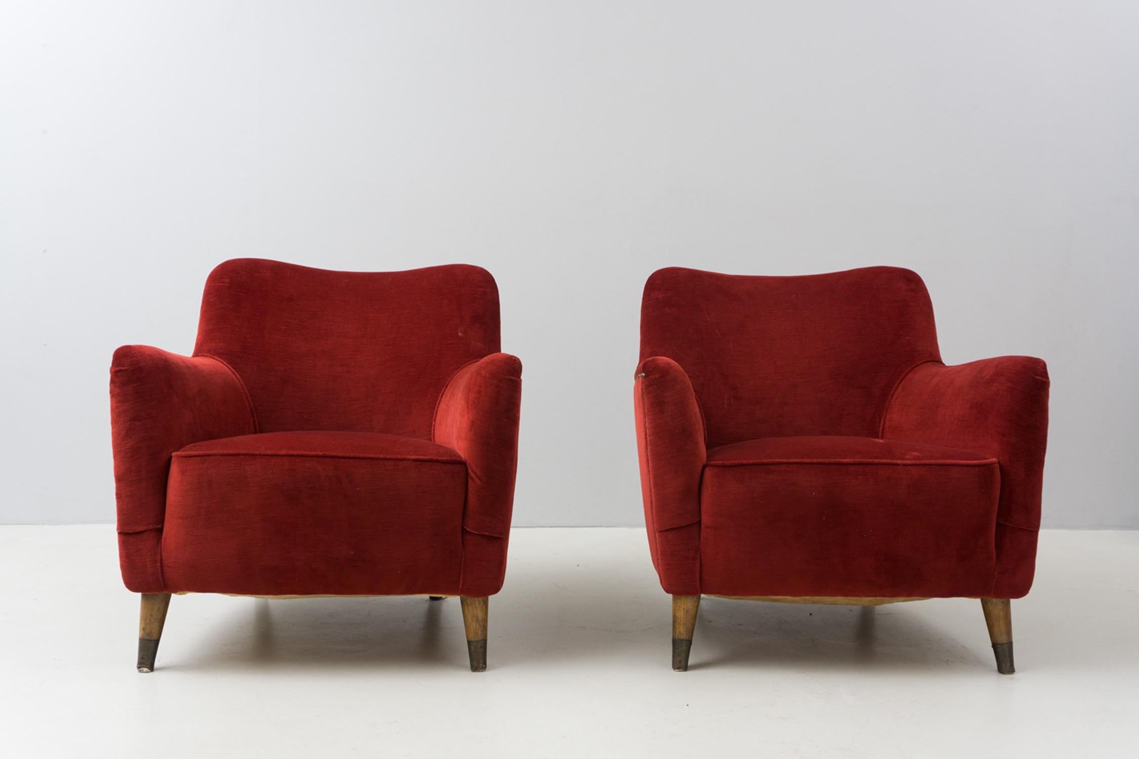 These beautiful and sophisticated armchairs were originally designed for the interior design for the luxurious first class sections of cruise liner 'Giulio Cesare' and 'Conte Grande' in 1948. Made of beech wood with brass shoes. Reupholstered with a