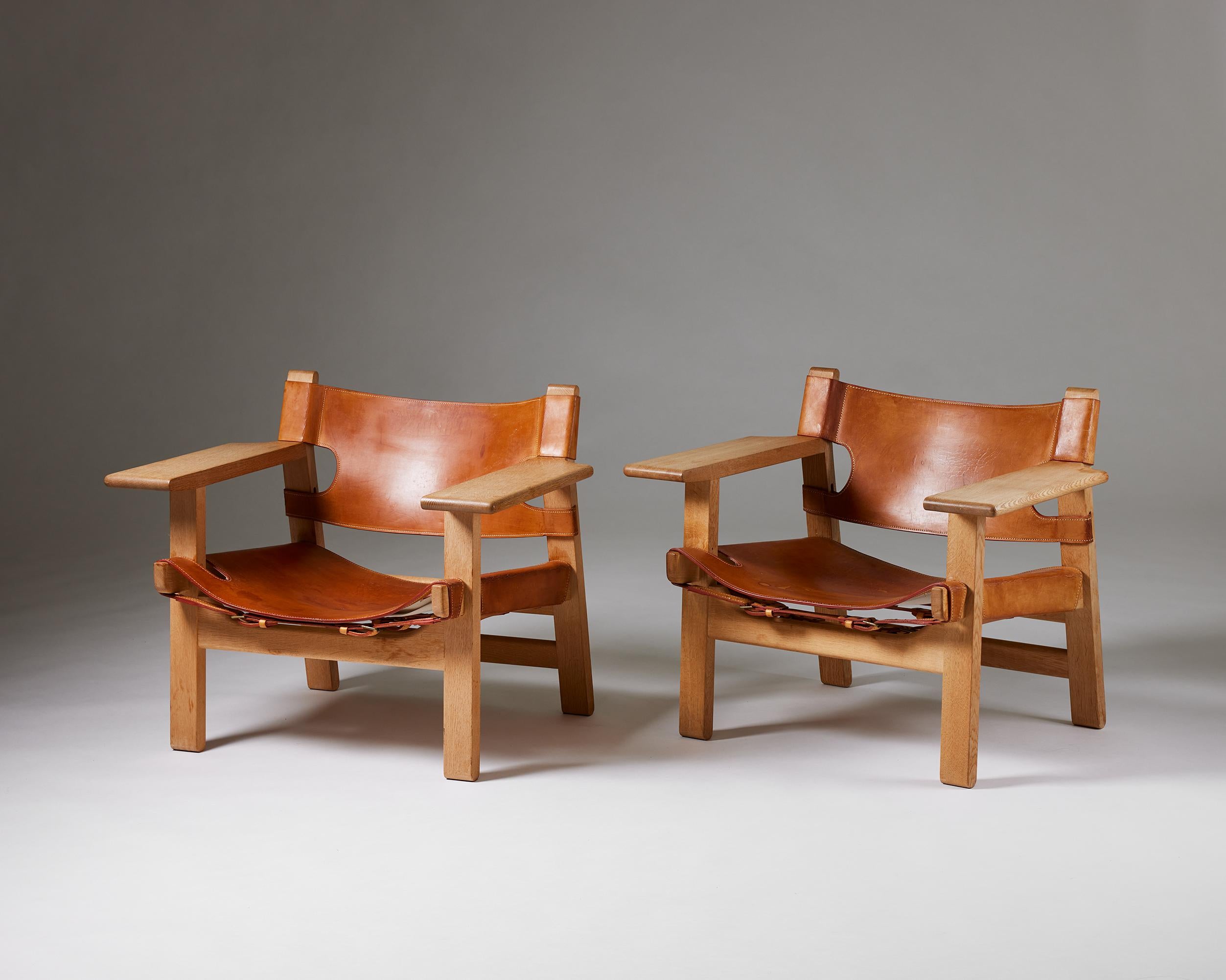 Pair of armchairs ‘The Spanish Chair’ model 2226 designed by Börge Mogensen for Fredericia Stolefabrik
Denmark, 1958.
Oak and cognac leather.

The robust construction, simple lines, and natural materials of Börge Mogensen’s “Spanish Chair” make it