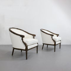 Pair of armchairs with carved bamboo-like frames and burl lacquered wood -