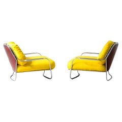 Pair of armchairs with chromed metal frame and backrest in leather