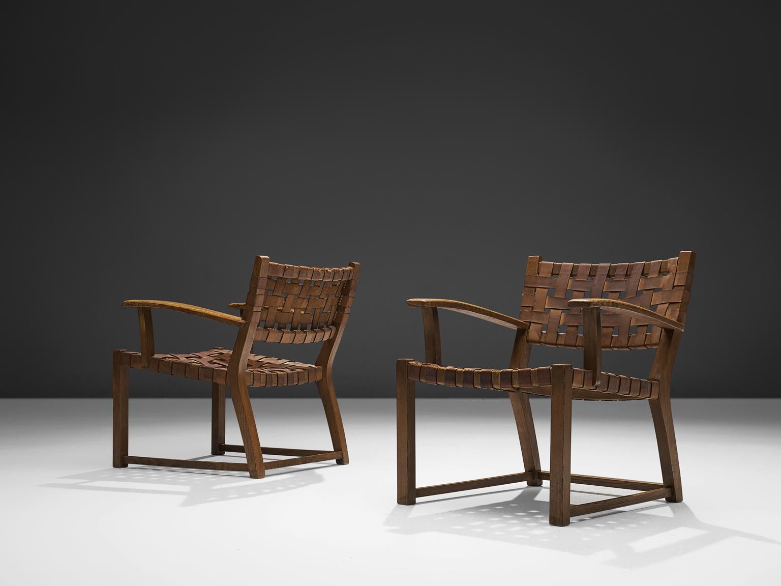 Armchairs, leather and oak, Scandinavia, 1950s

These elegant armchairs feature wonderful patinated leather on both seat and back. The patina on this chair creates a vibrant look and the straps in the seat form a thick, well-constructed yet